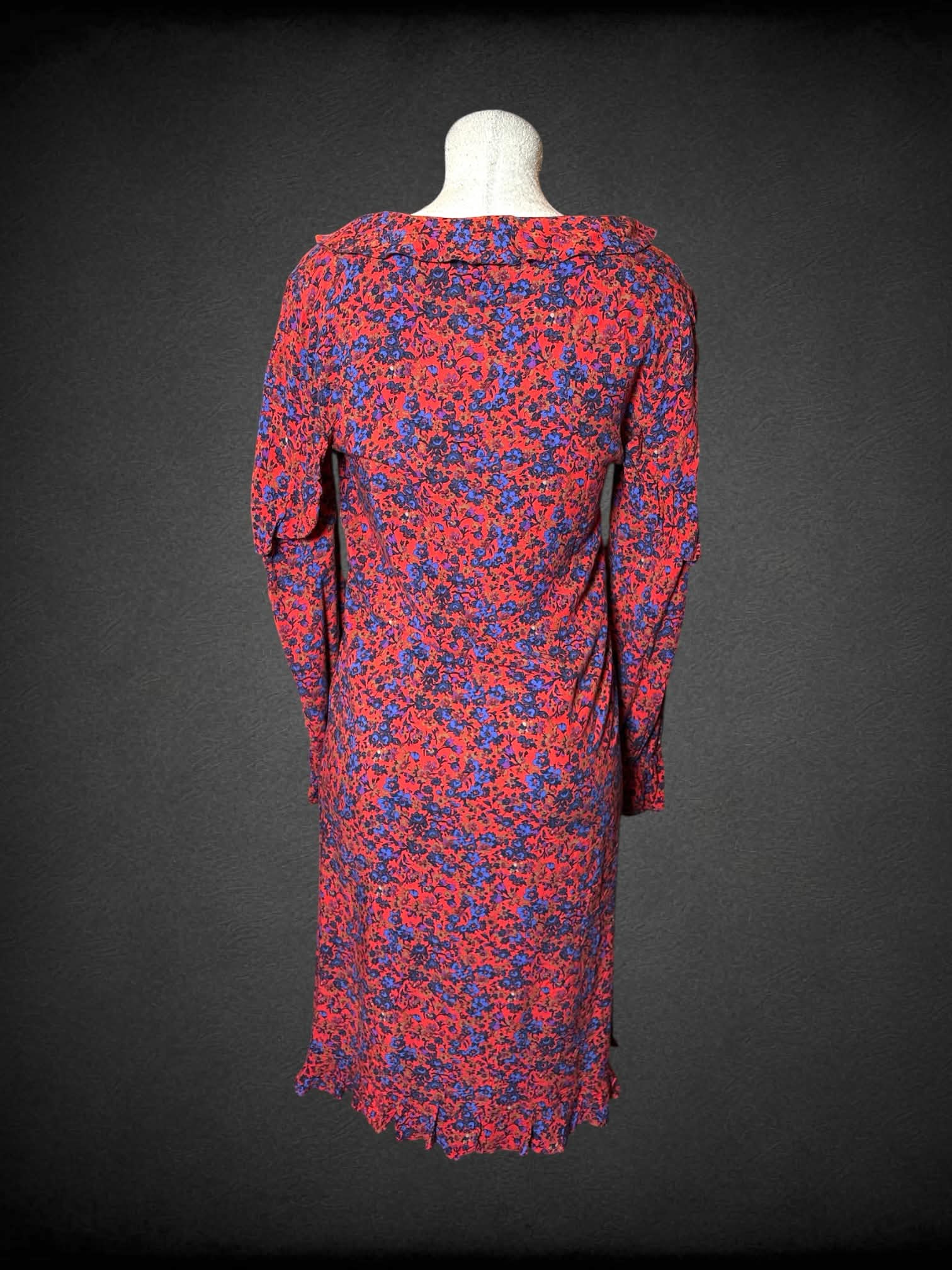 L H&M red long-sleeve dress with blue floral pattern, and wrap-around clasp on front