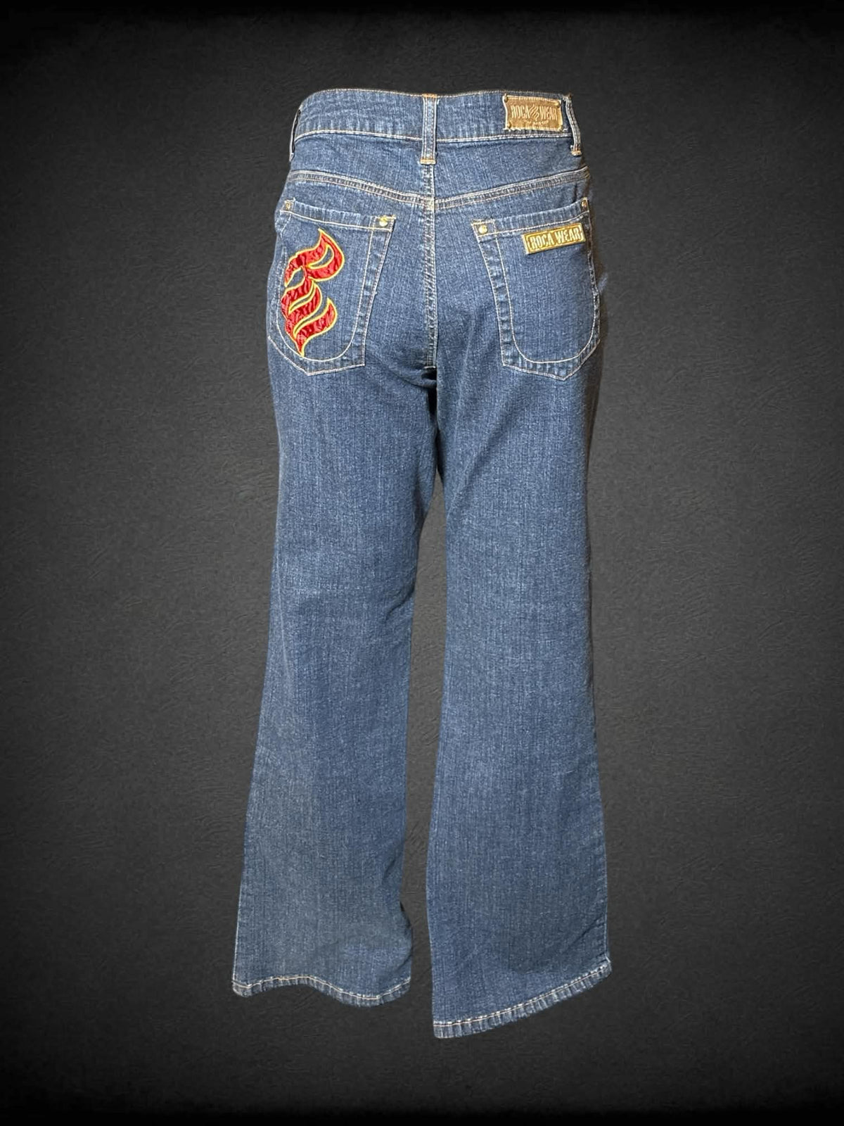 L Roca Wear NWT blue mid-rise wide cut jeans with embroidered chain design on front, and metal logo and embroidery on back pockets