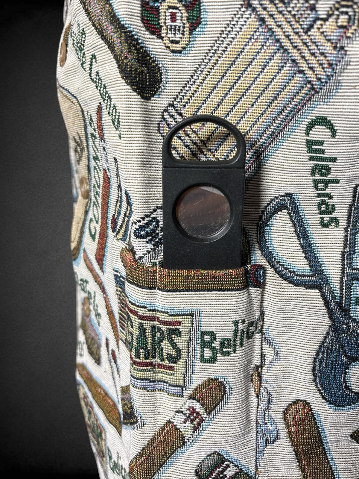0X Cigargoyles vintage tan canvas button-up vest with cigar and match pattern, and cigar cutter in pocket