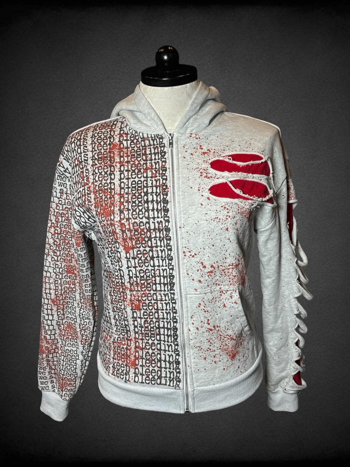 1X PS designer 1 of 200 grey distressed hoodie with fake blood stains, and “Keep Bleeding” design, and “We All Bleed” embroidery on hood