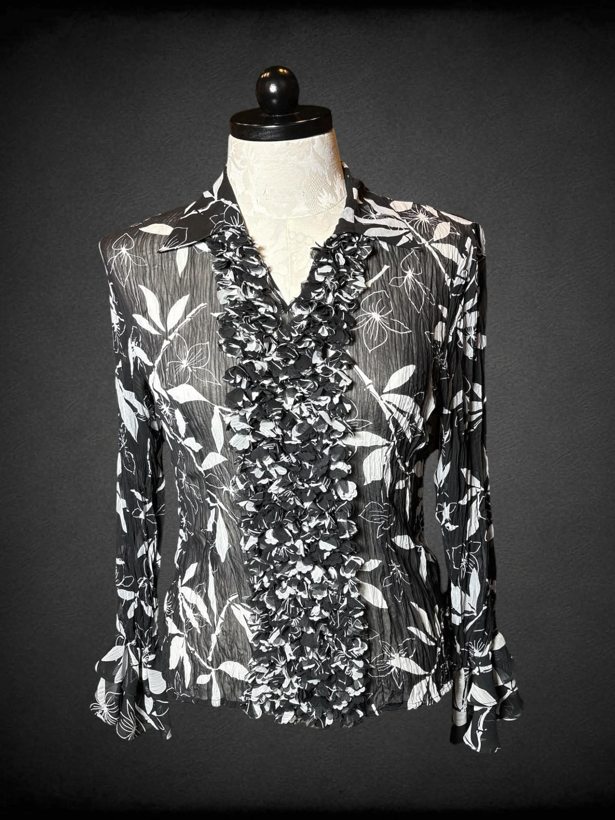 0X D&Y vintage black sheer long-sleeve blouse with white floral pattern, ruffle bell sleeves, and ruffle design on front