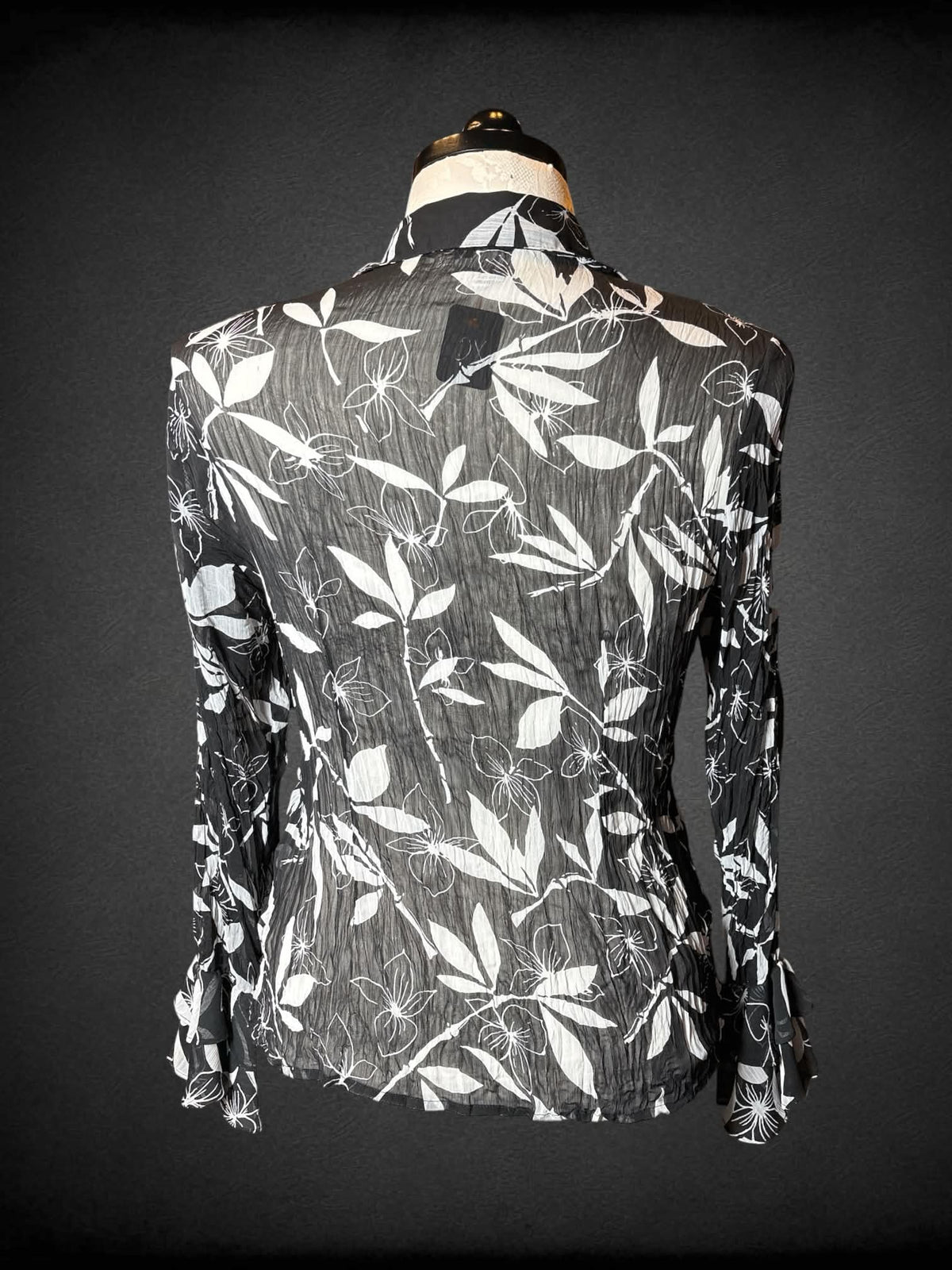 0X D&Y vintage black sheer long-sleeve blouse with white floral pattern, ruffle bell sleeves, and ruffle design on front