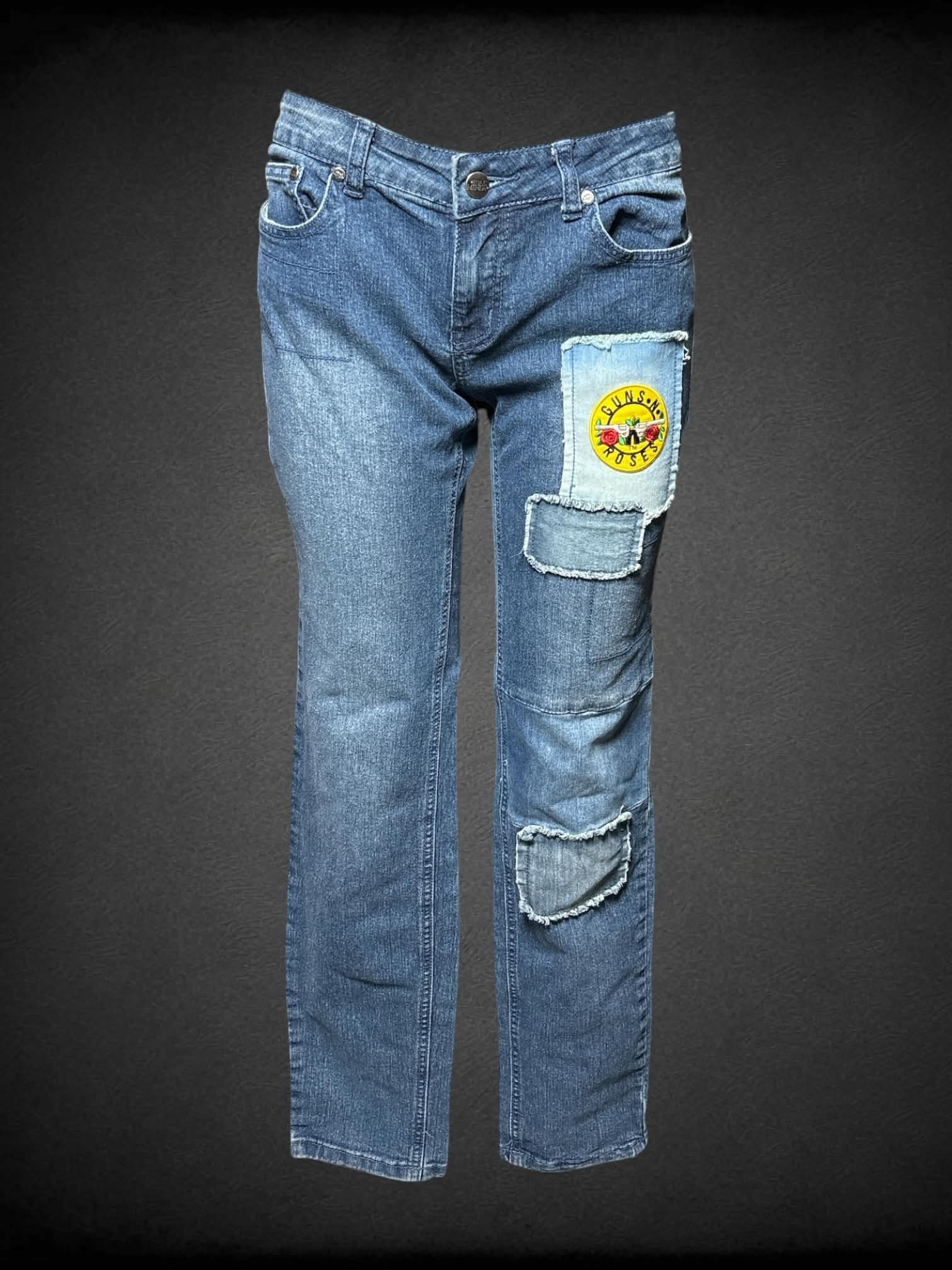 L Idle Minds blue jeans with distressed patch design, and rock n roll patches on front and back