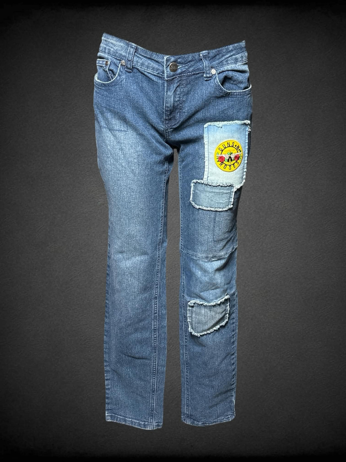 L Idle Minds blue jeans with distressed patch design, and rock n roll patches on front and back
