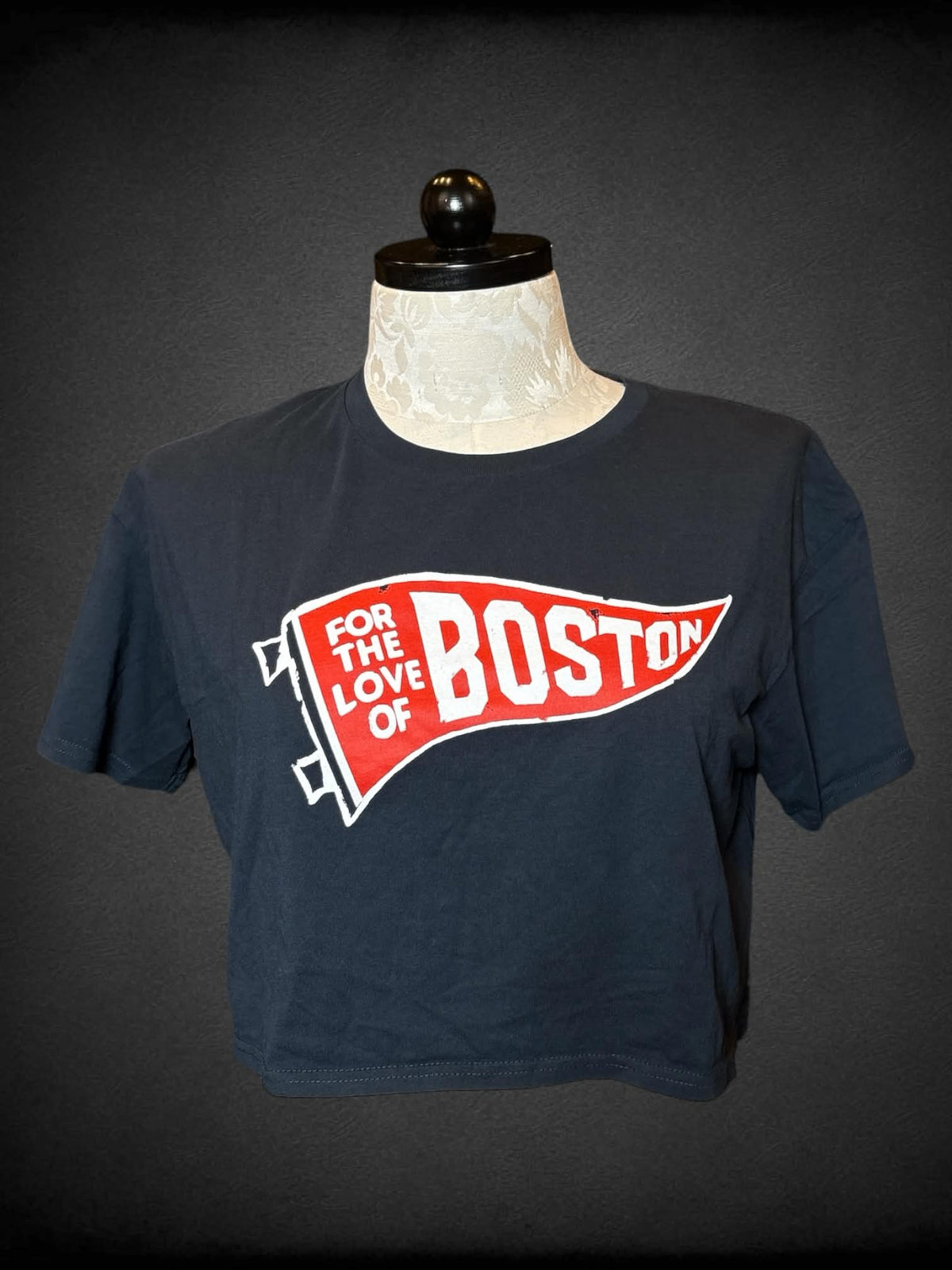 1X Samuel Adams black cropped t shirt with “For The Love of Boston” flag graphic on front, and “Samuel Adams” logo on sleeve