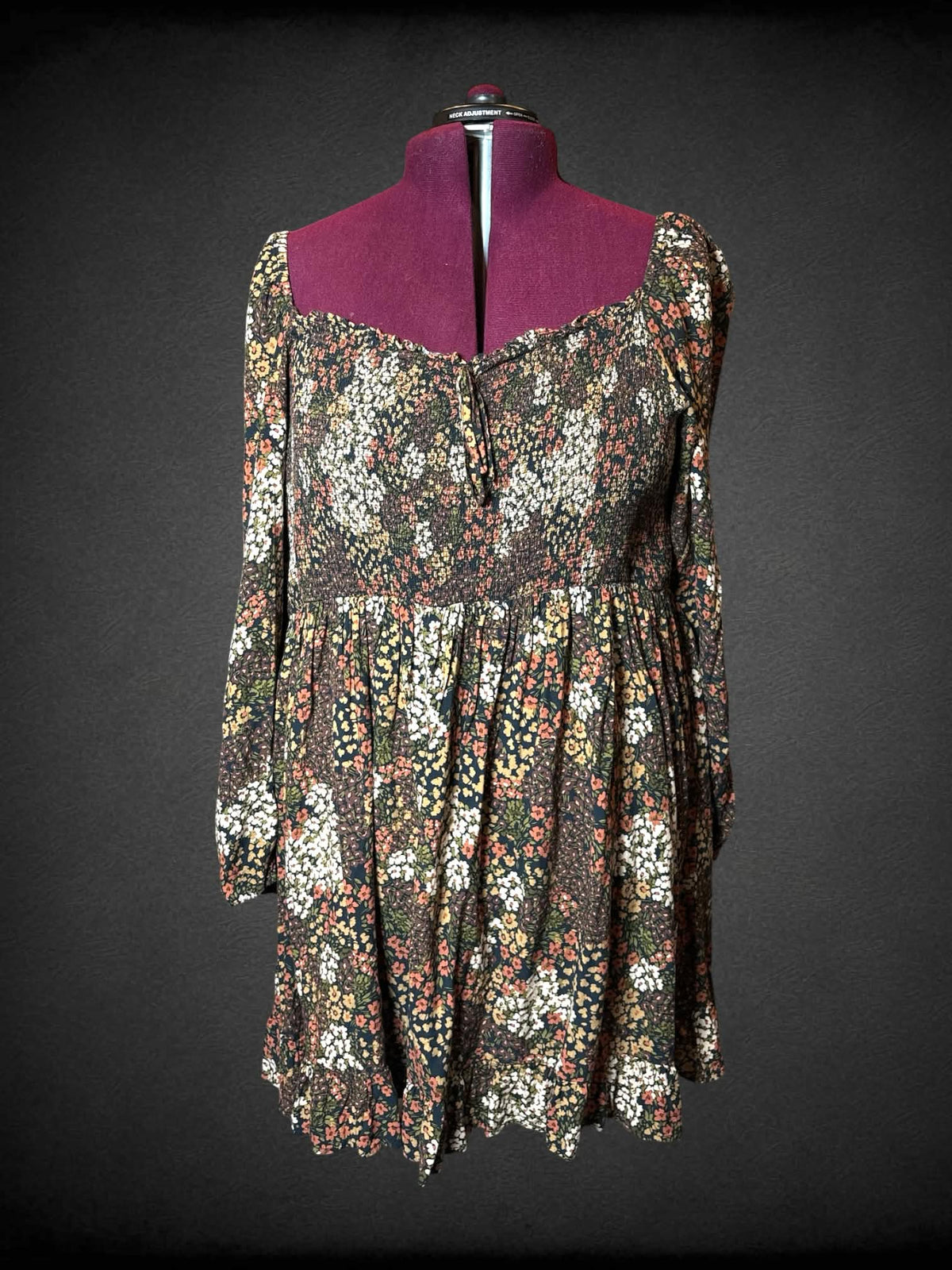 2X City Chic brown long-sleeve short dress with floral pattern, and shirred top