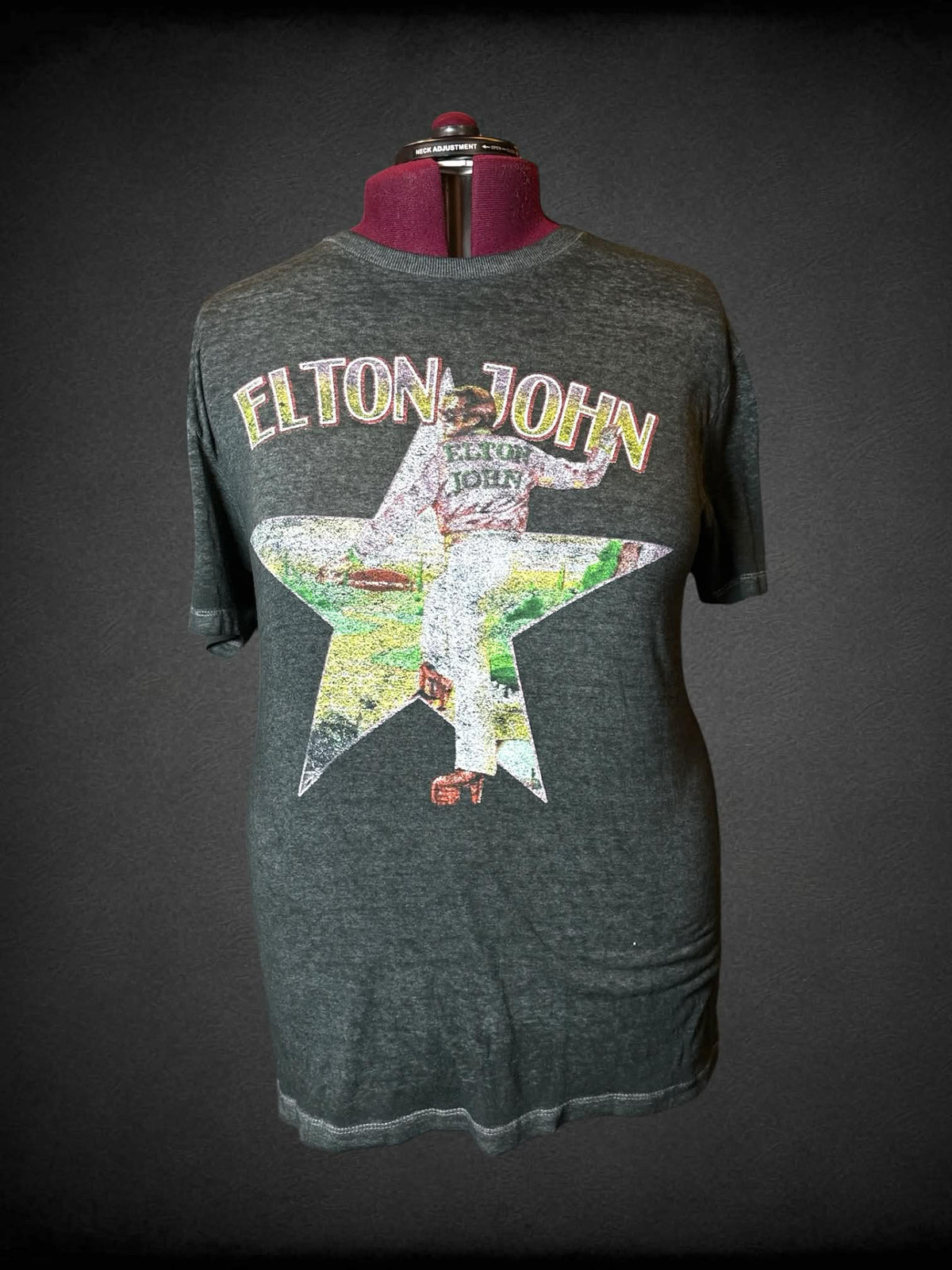 3X Elton grey t shirt with Elton John’s “Farewell Yellow Brick Road Tour” graphic on front and tour dates on back