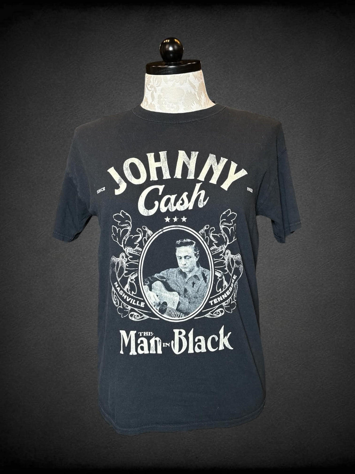 1X black t shirt with faded “Johnny Cash” graphic on front
