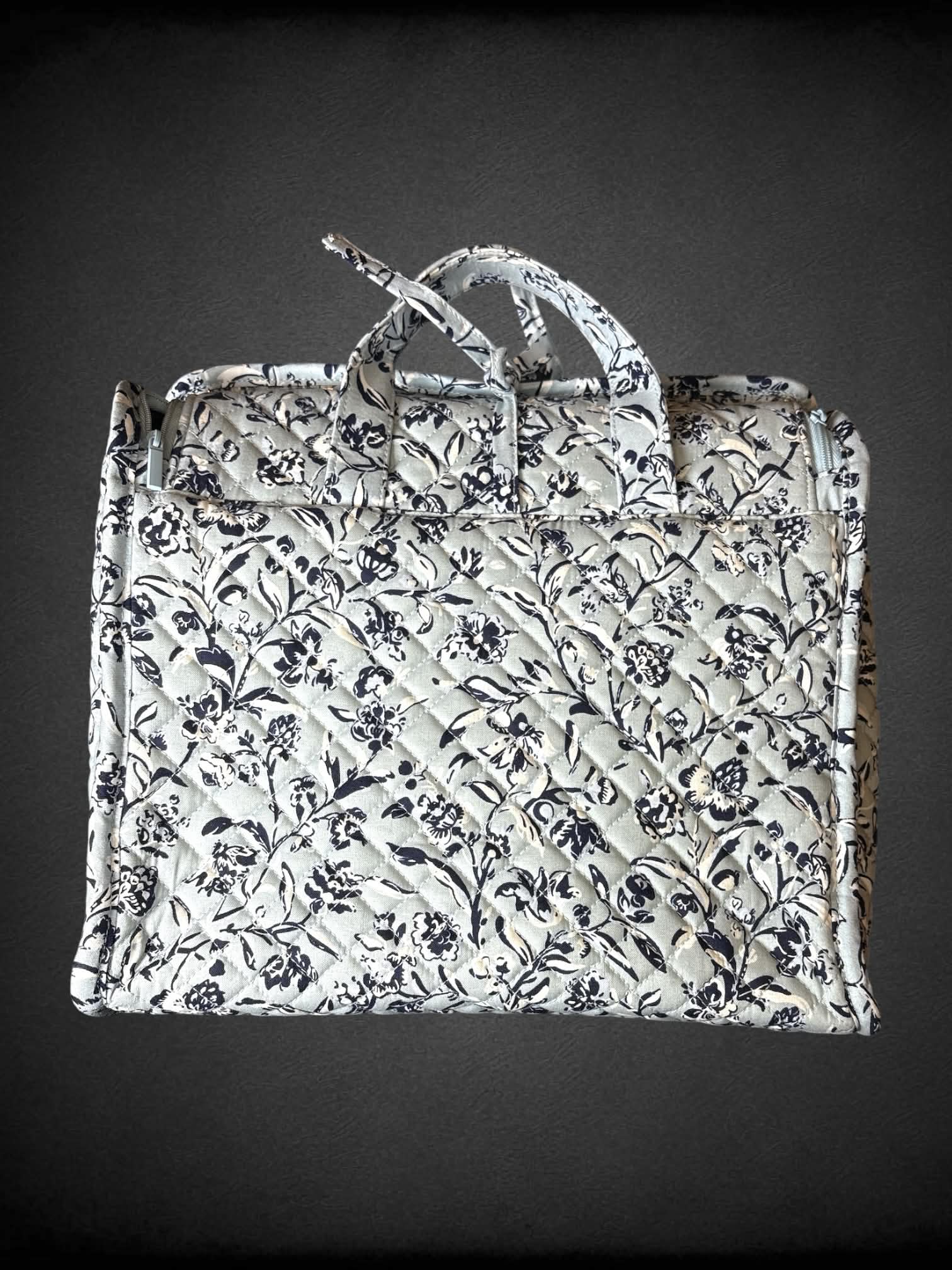 Vera Bradley NWT light blue travel bag with floral design, and zipper and clear pockets
