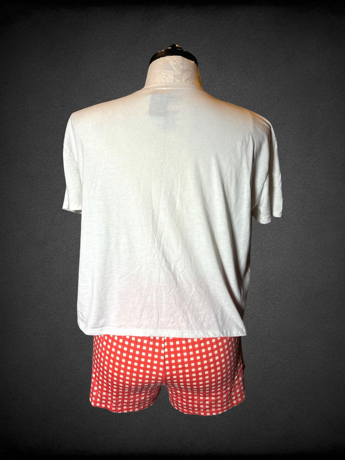 XL Peanuts two-piece set with white t shirt with “Snoopy Cafe” graphic, and orange soft grid shorts with stretch waist