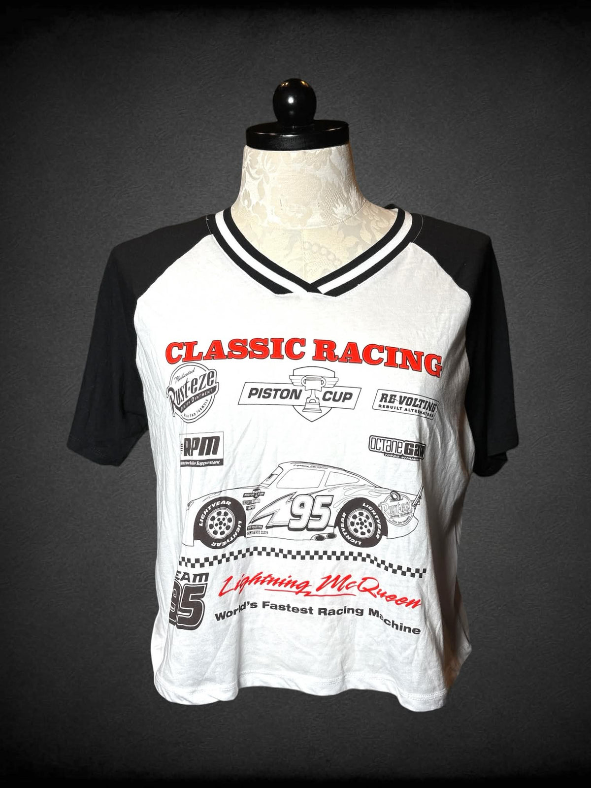 1X Disney Pixar black & white raglan t shirt with racing car graphic from Disney’s “Cars” on front, and jersey number on back