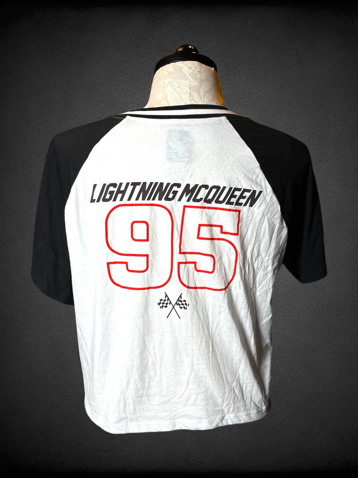 1X Disney Pixar black & white raglan t shirt with racing car graphic from Disney’s “Cars” on front, and jersey number on back