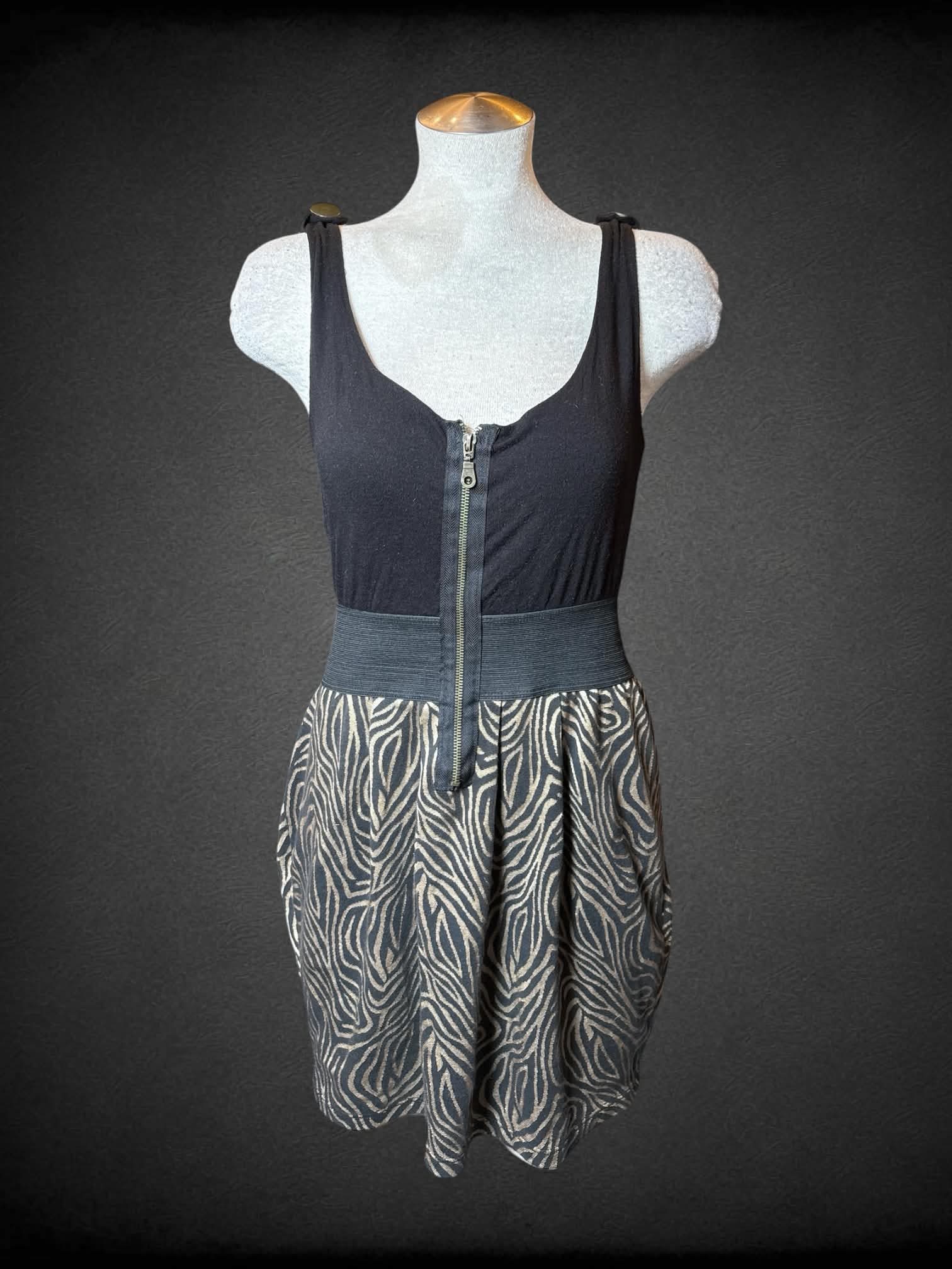 L 5th Culture Y2K black short dress with gold zebra pattern on skirt, and zipper on front