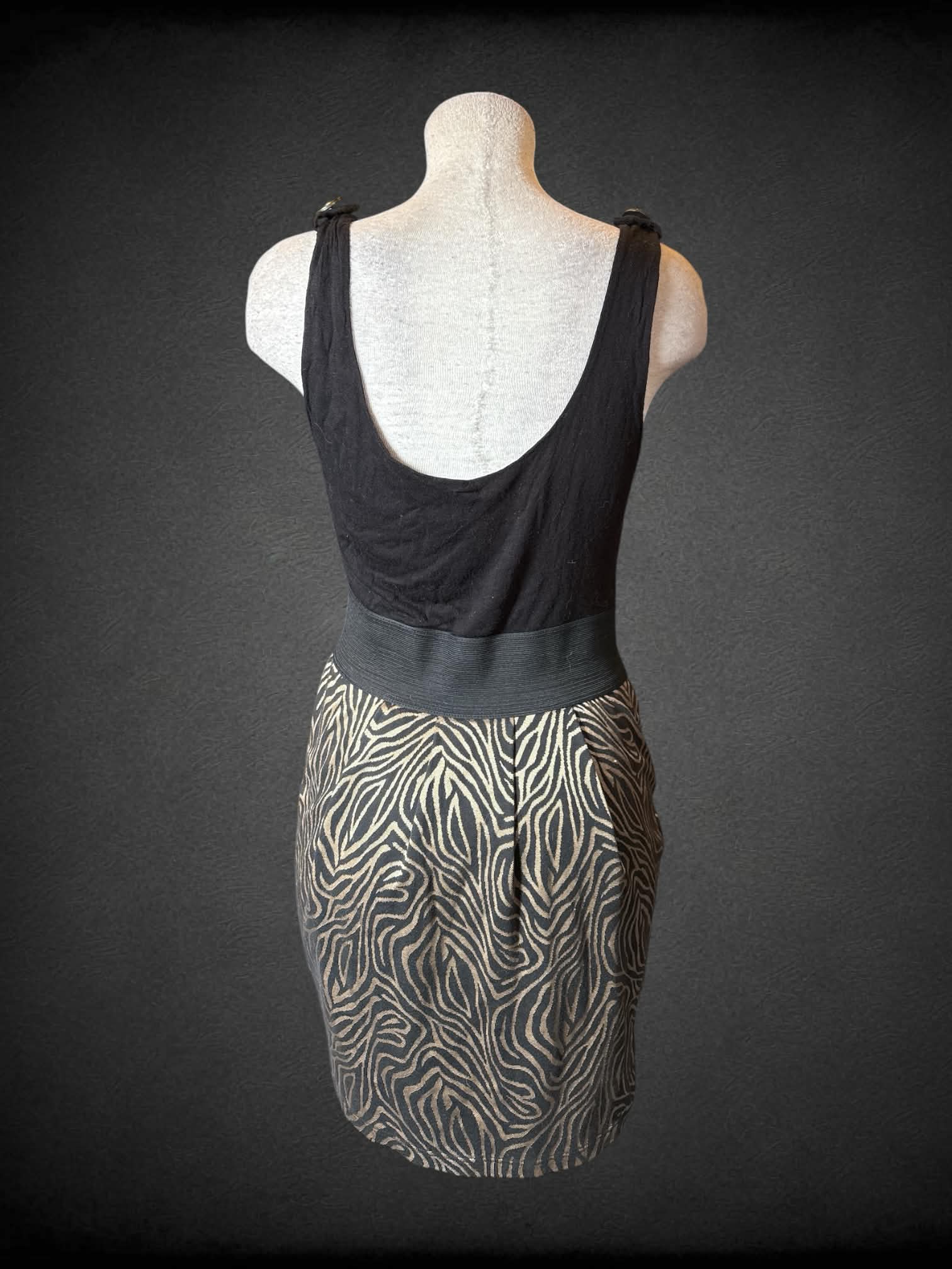L 5th Culture Y2K black short dress with gold zebra pattern on skirt, and zipper on front