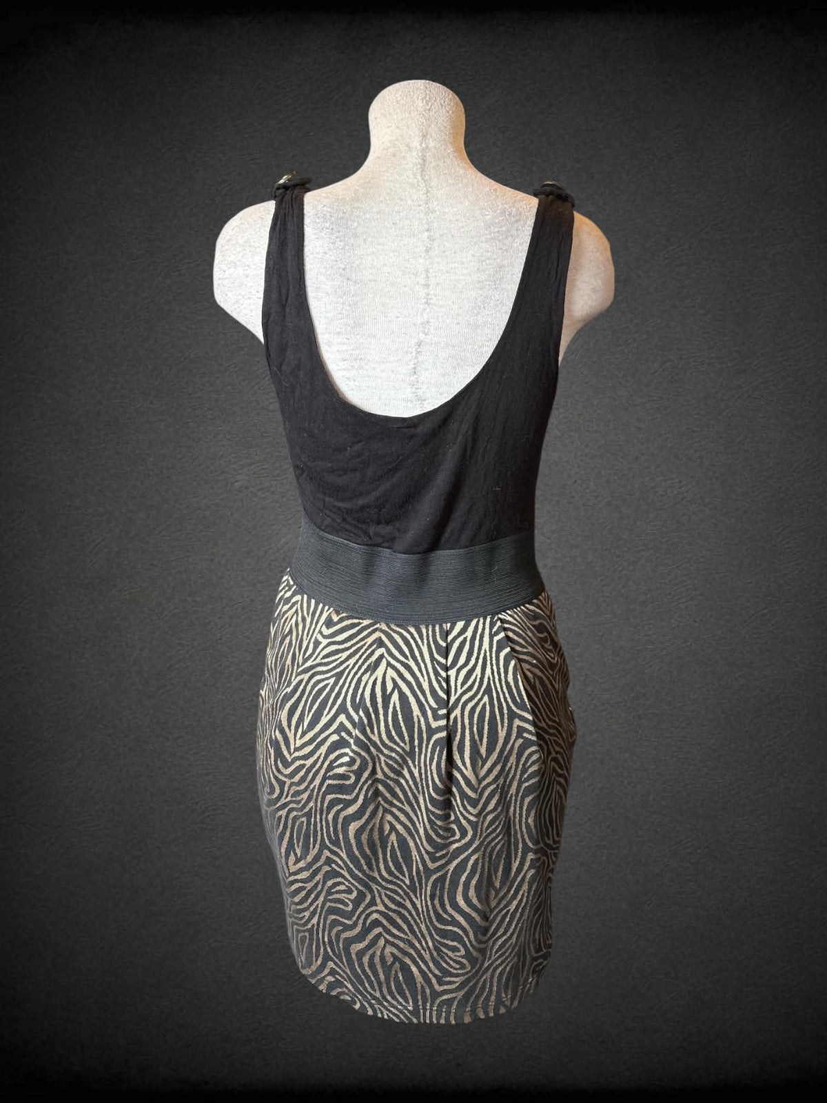 L 5th Culture Y2K black short dress with gold zebra pattern on skirt, and zipper on front