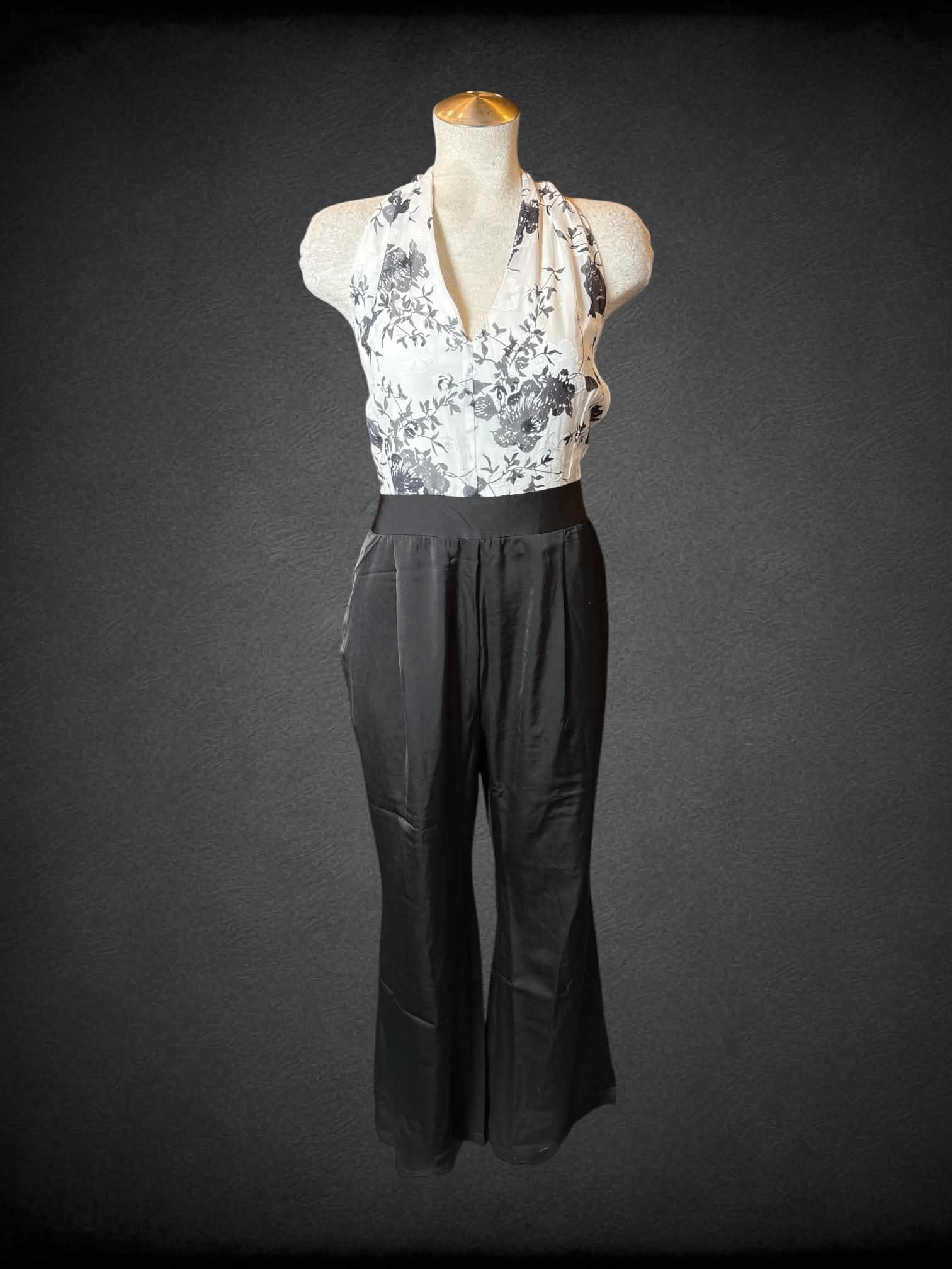 L Retro Stage NWT black & white formal jumpsuit with halter top, black floral design, pockets, and zipper on back