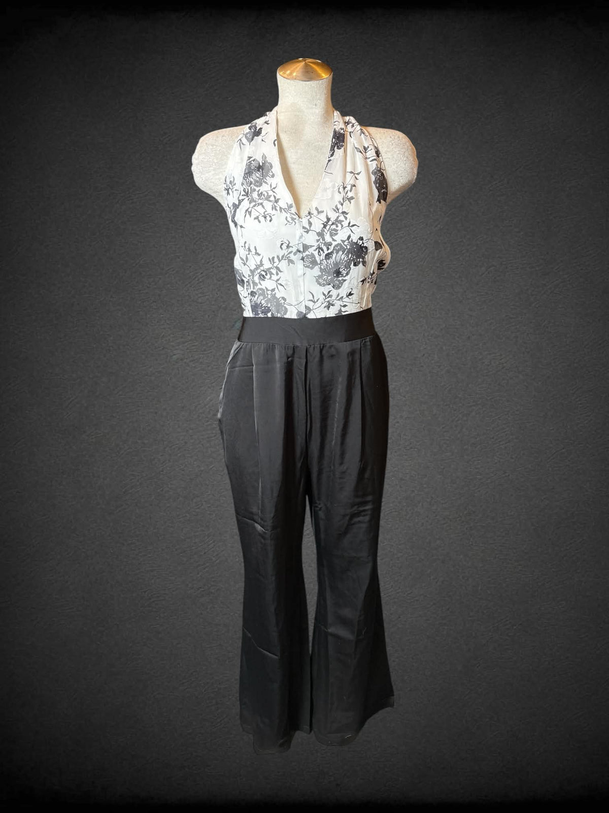L Retro Stage NWT black & white formal jumpsuit with halter top, black floral design, pockets, and zipper on back