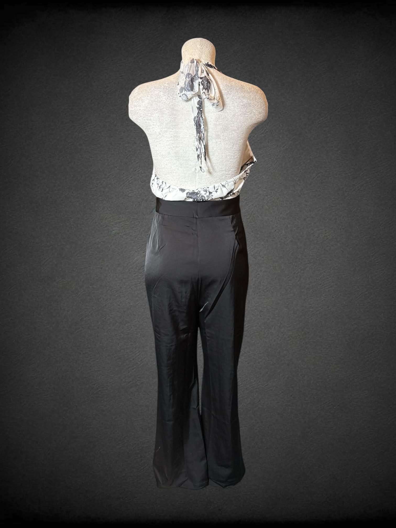 L Retro Stage NWT black & white formal jumpsuit with halter top, black floral design, pockets, and zipper on back