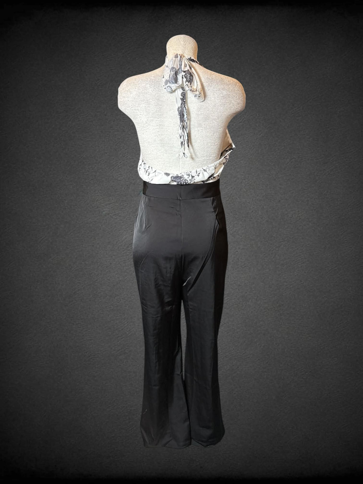 L Retro Stage NWT black & white formal jumpsuit with halter top, black floral design, pockets, and zipper on back
