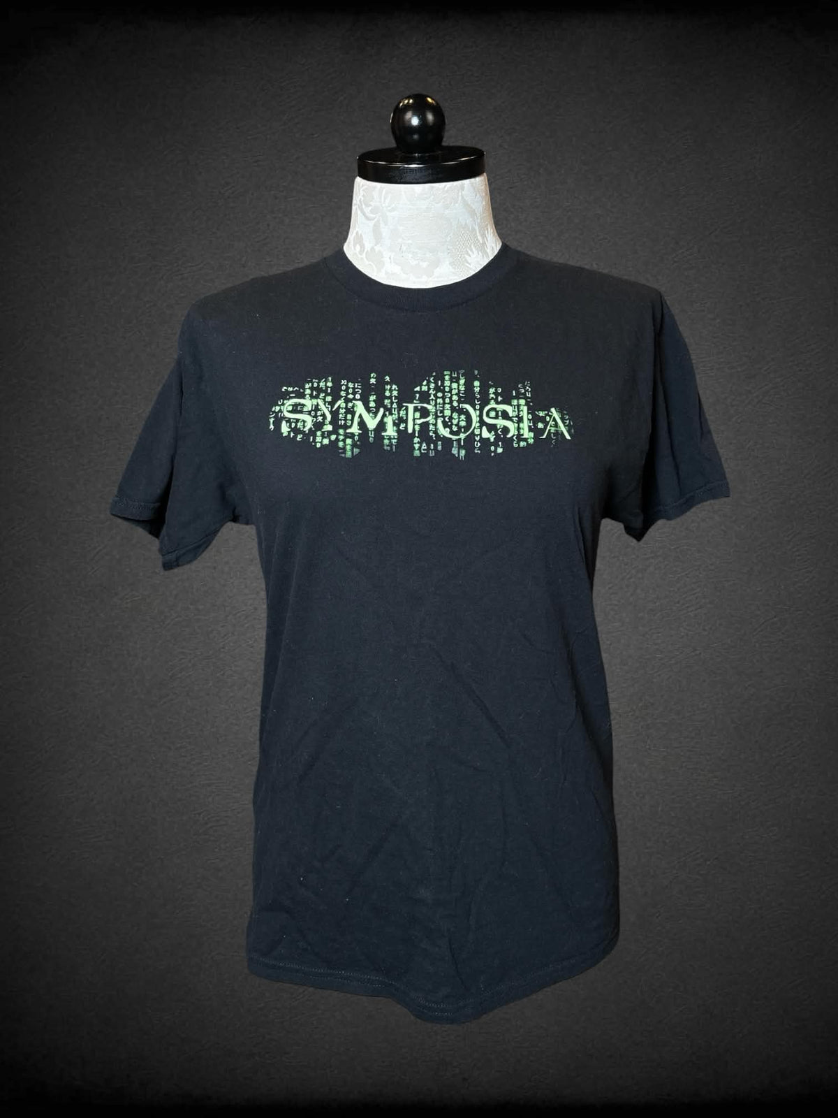 1X Gildan black t shirt with “Symposia” matrix writing on front, and alien graphic on back