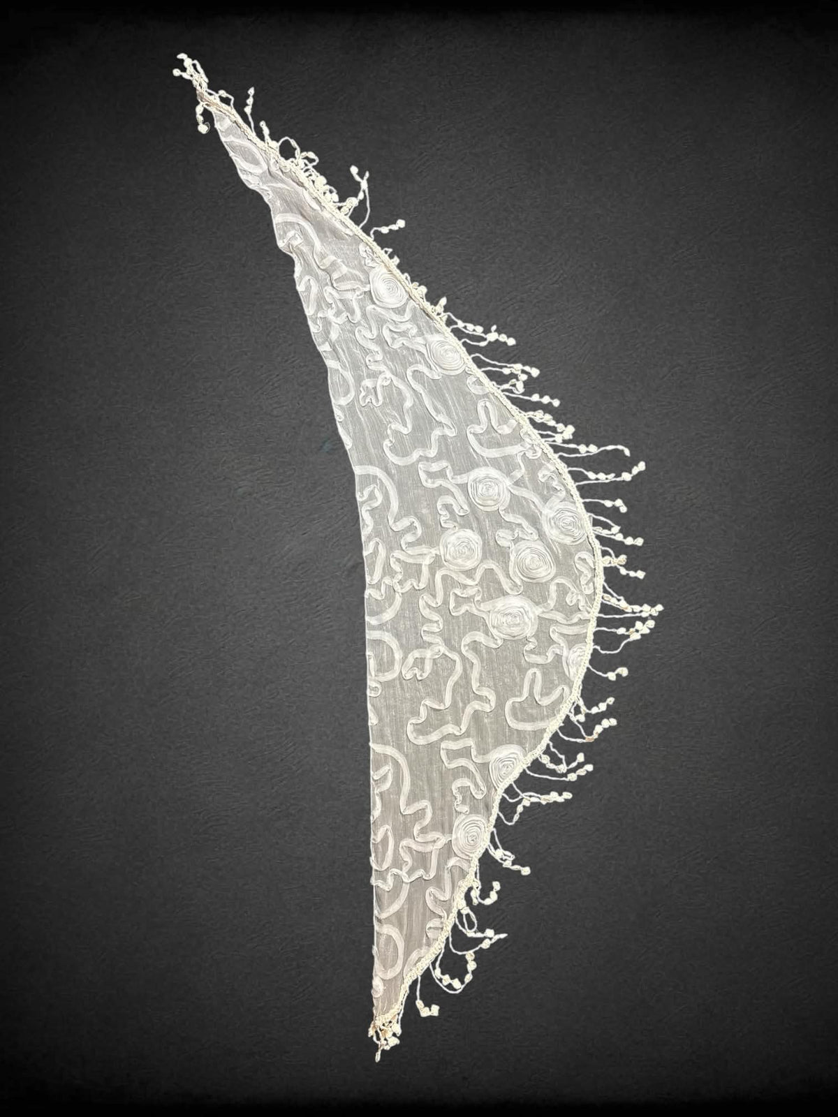 60 inch white sheer waist wrap/scarf with textured rose design, and tassels. Fits up to 2X