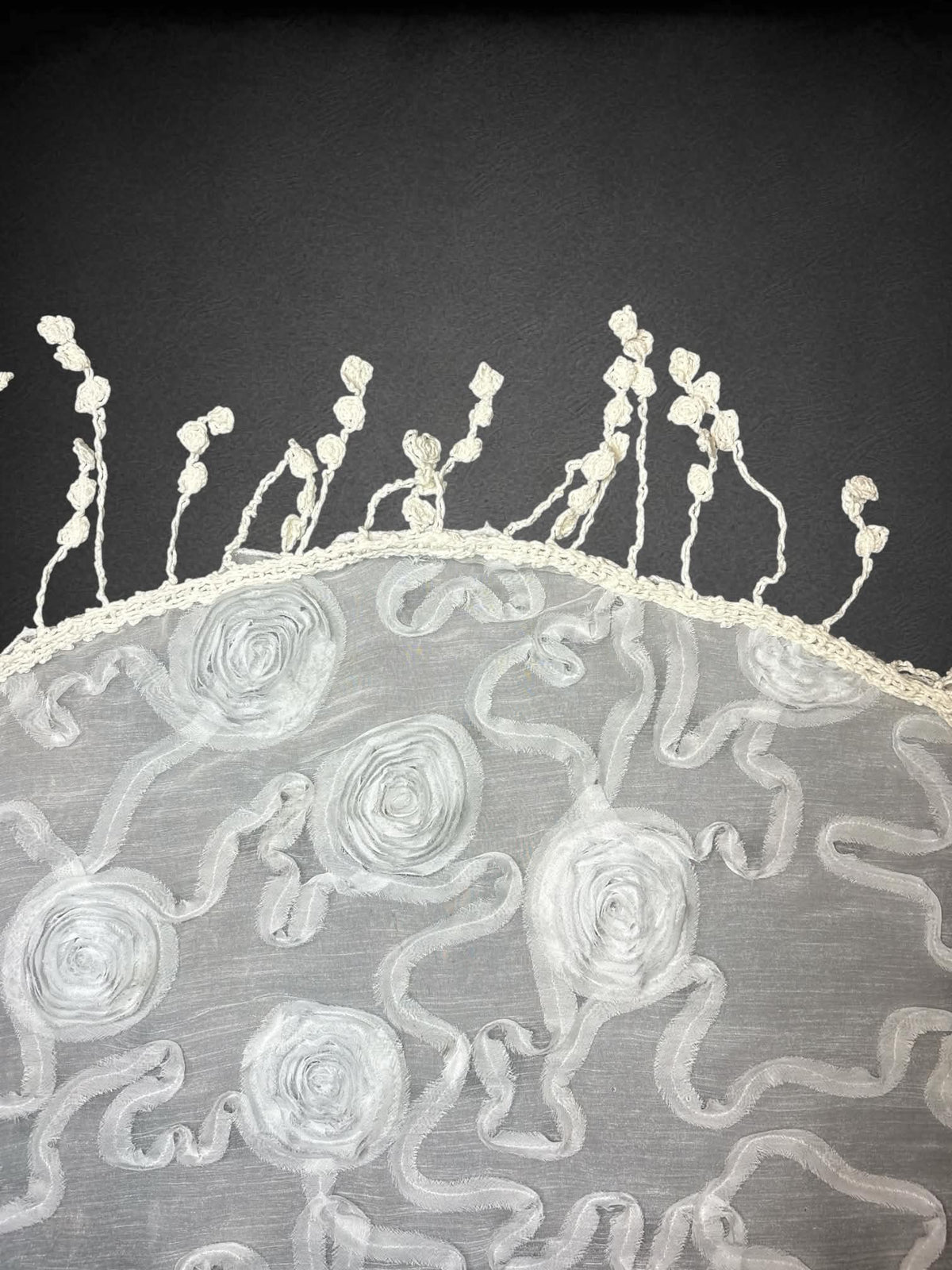 60 inch white sheer waist wrap/scarf with textured rose design, and tassels. Fits up to 2X