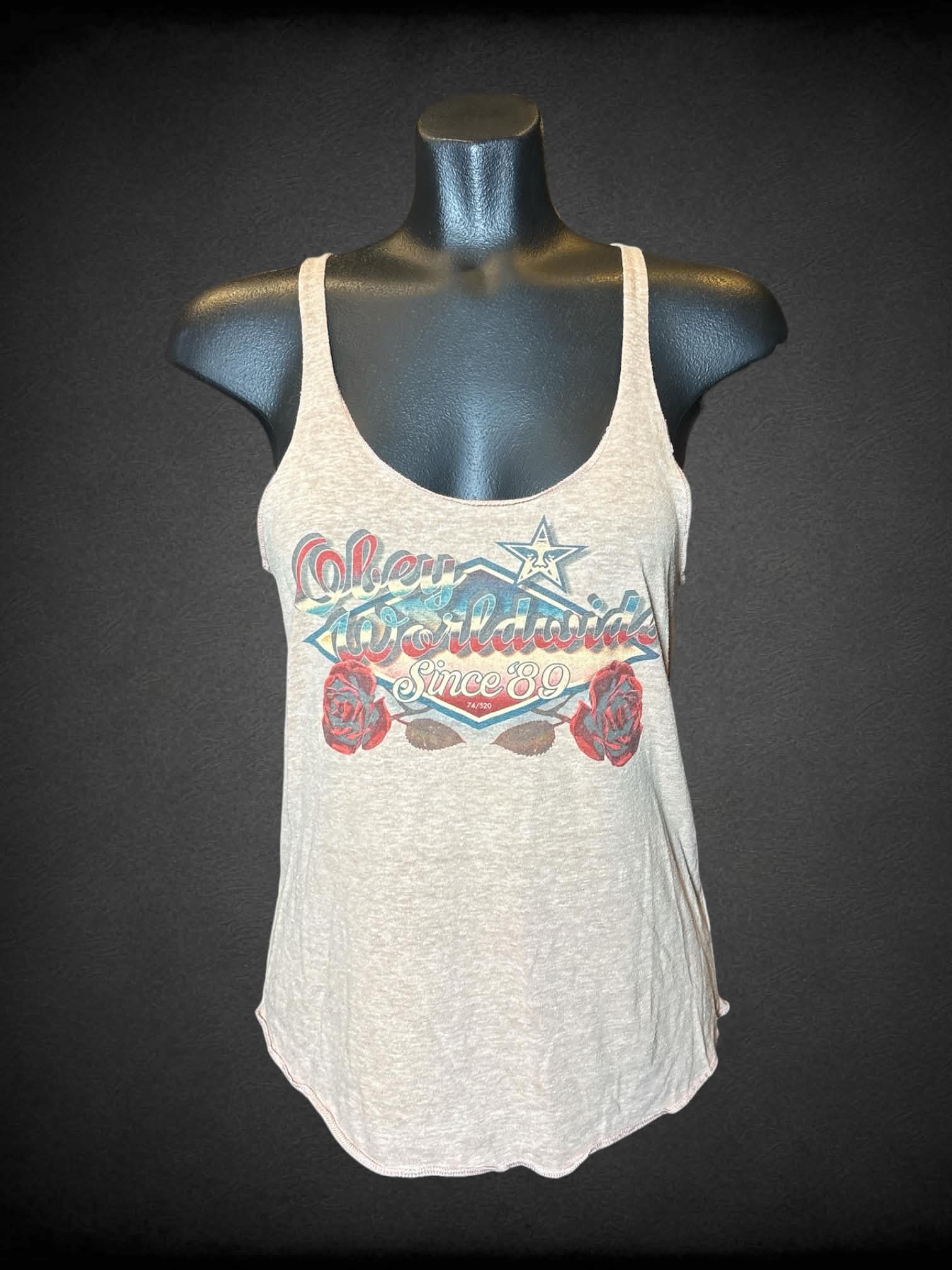M Obey tan tank top with “Obey Worldwide” vintage-style graphic on front