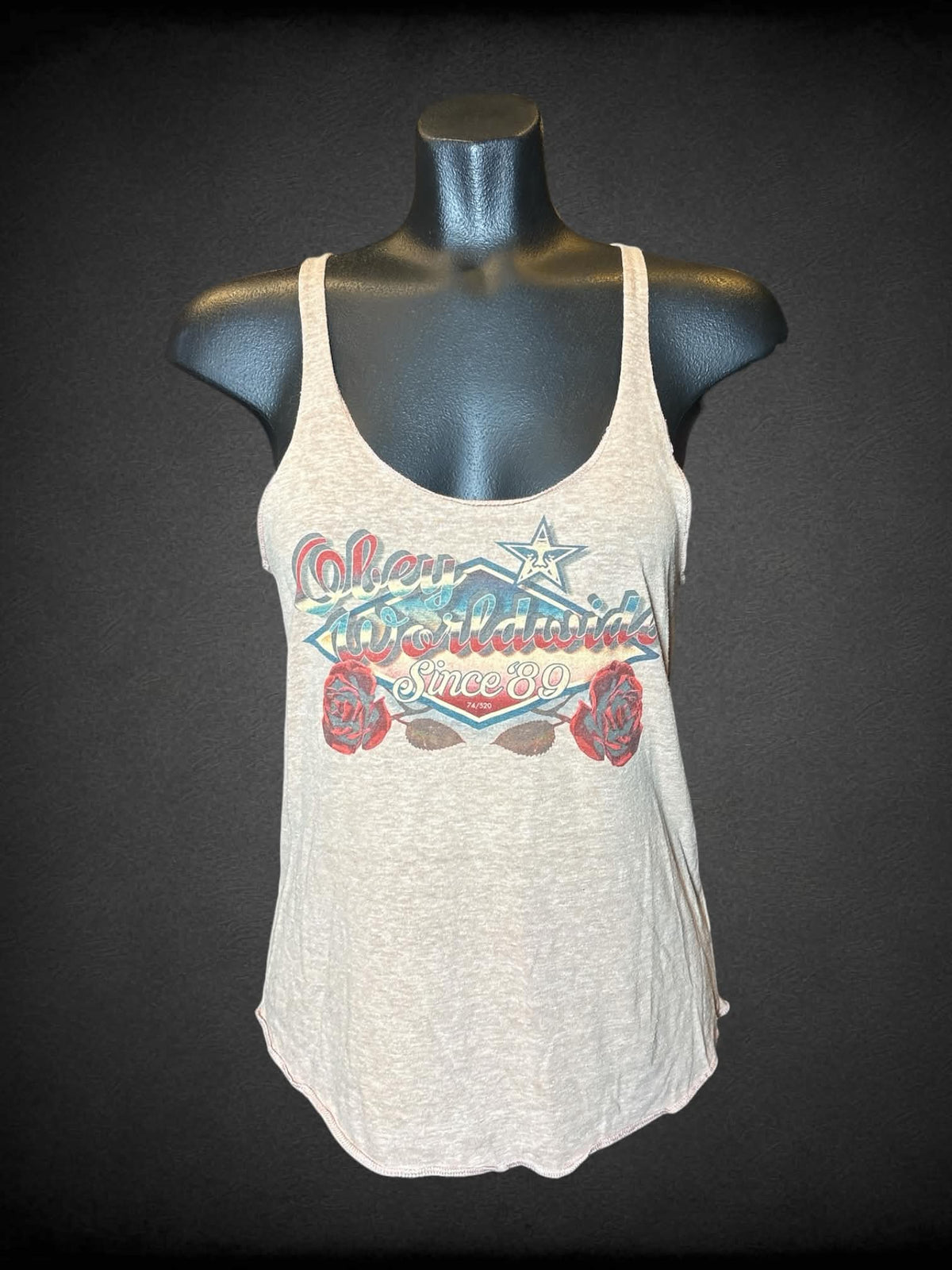 M Obey tan tank top with “Obey Worldwide” vintage-style graphic on front