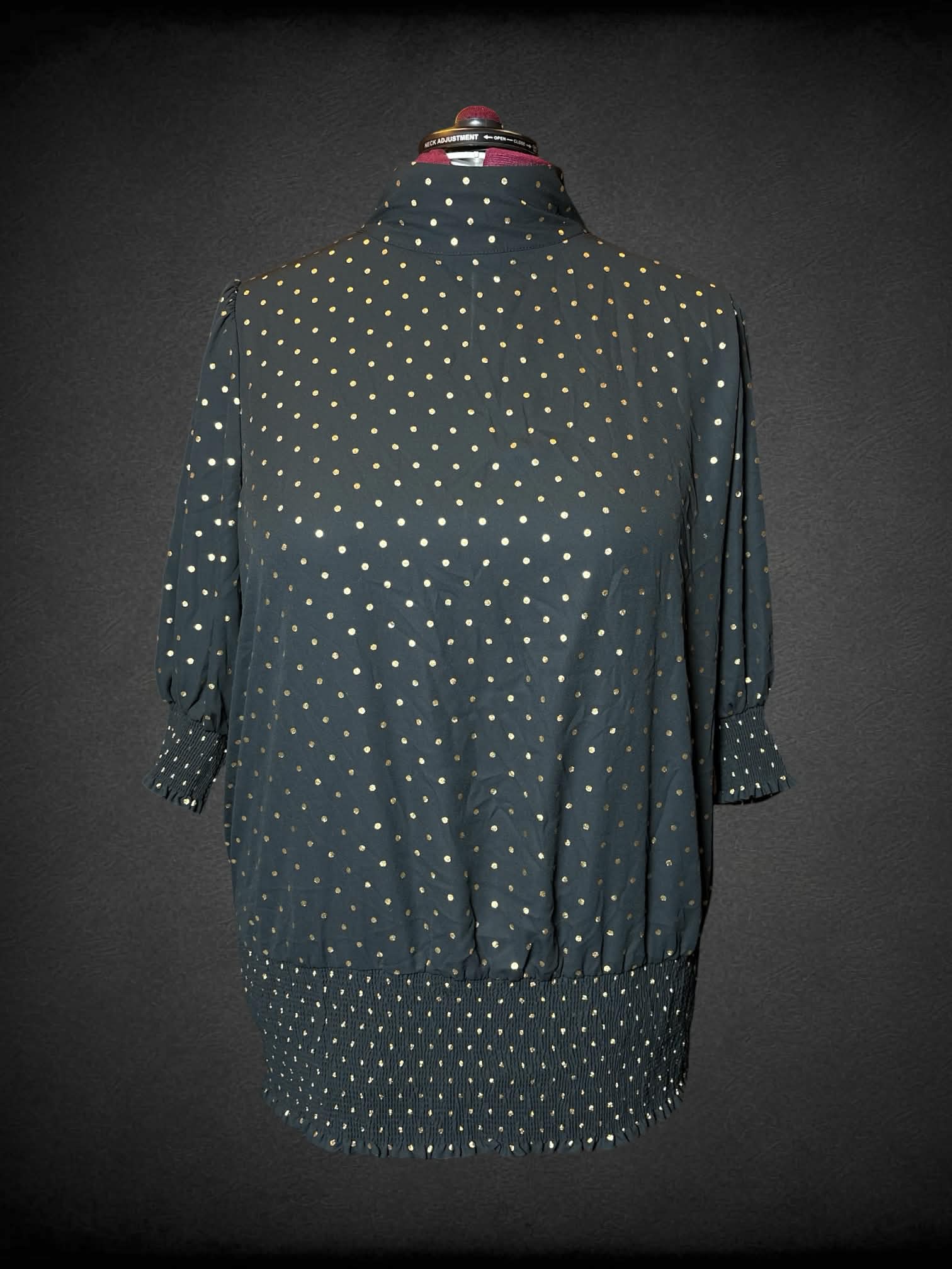 3X June + Vie black turtleneck blouse with gold polka-dot pattern, and shirred hem