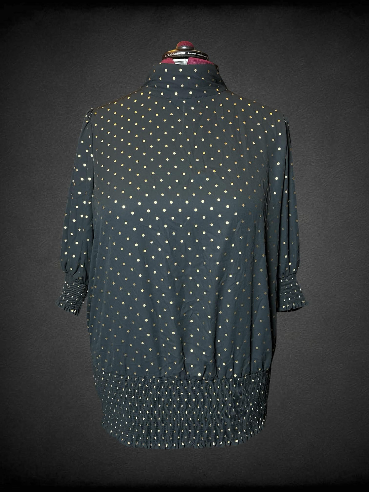 3X June + Vie black turtleneck blouse with gold polka-dot pattern, and shirred hem