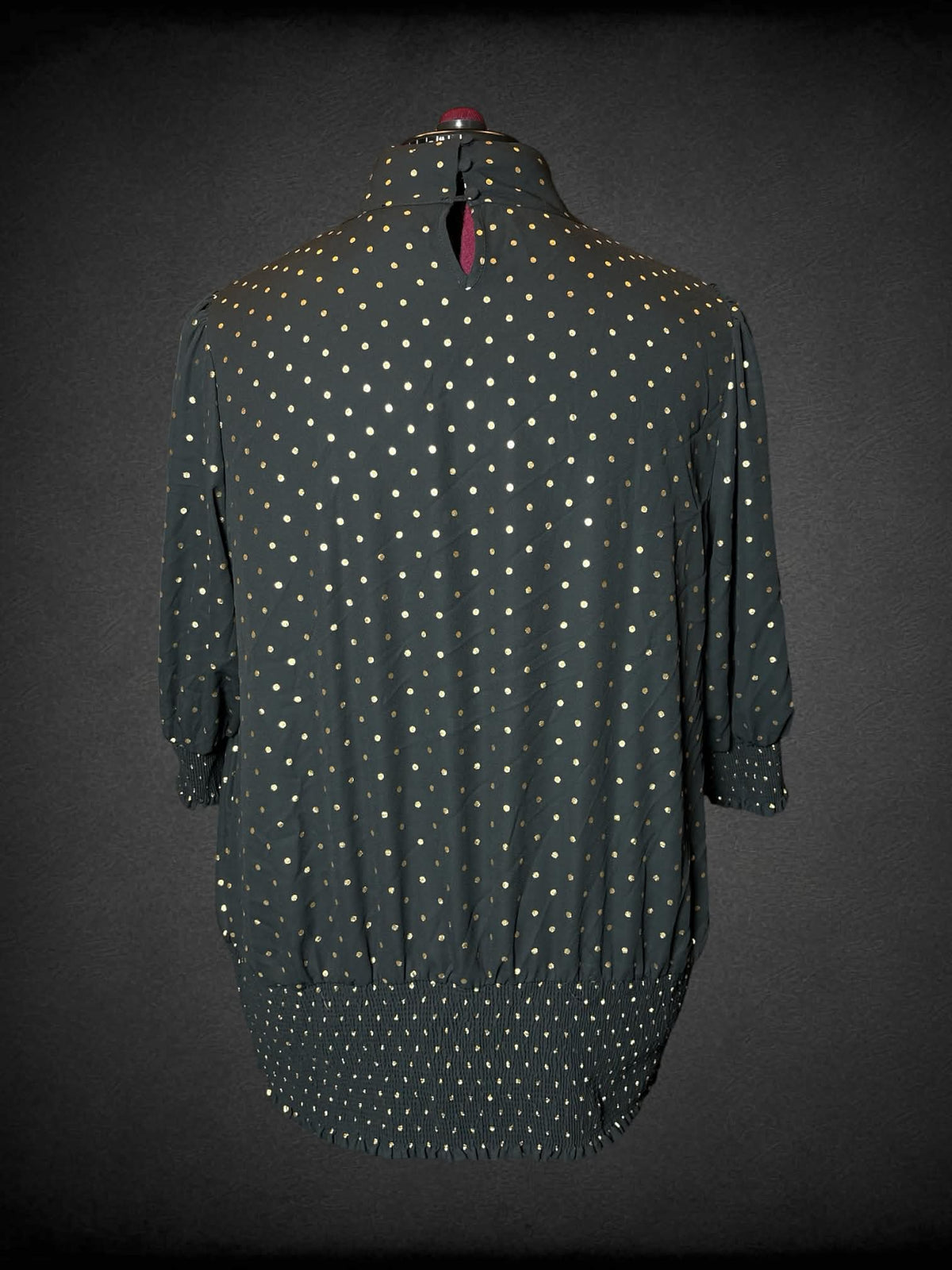 3X June + Vie black turtleneck blouse with gold polka-dot pattern, and shirred hem