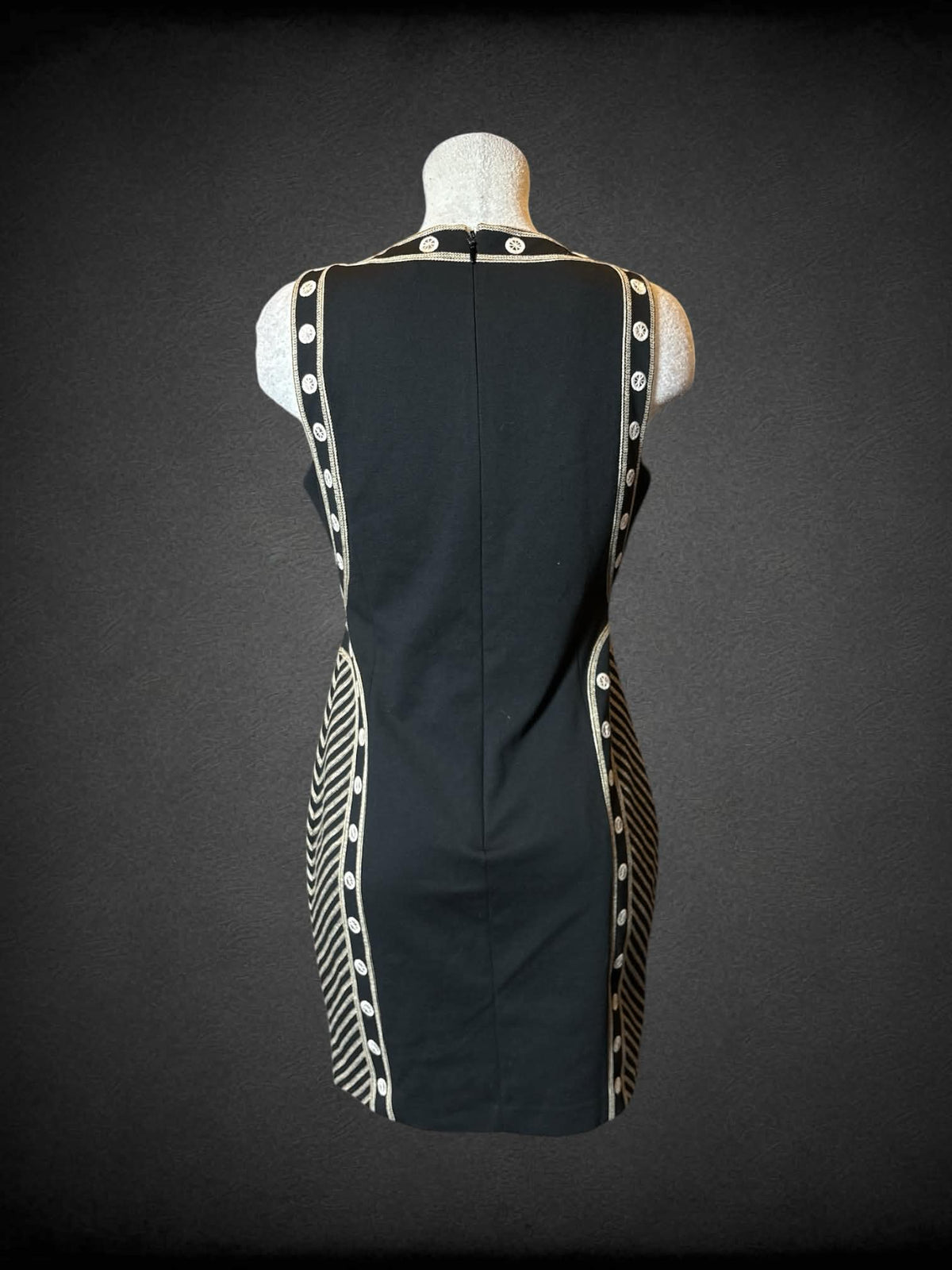 L BCBG Max Azria black short dress with brown woven detailing, and zipper and clasp on back