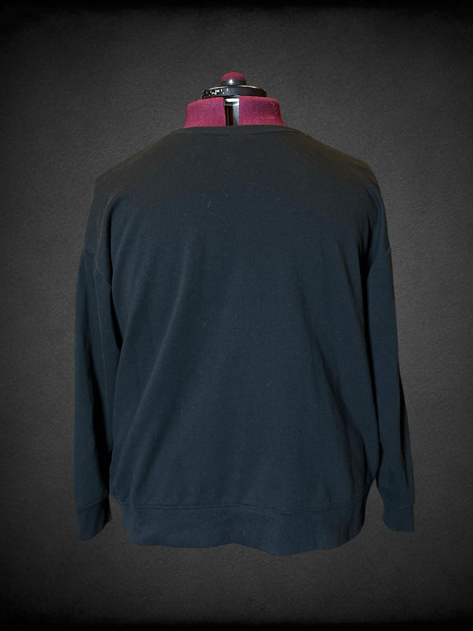 3X Torrid black long-sleeve crewneck sweater with multicolor stripes on front
