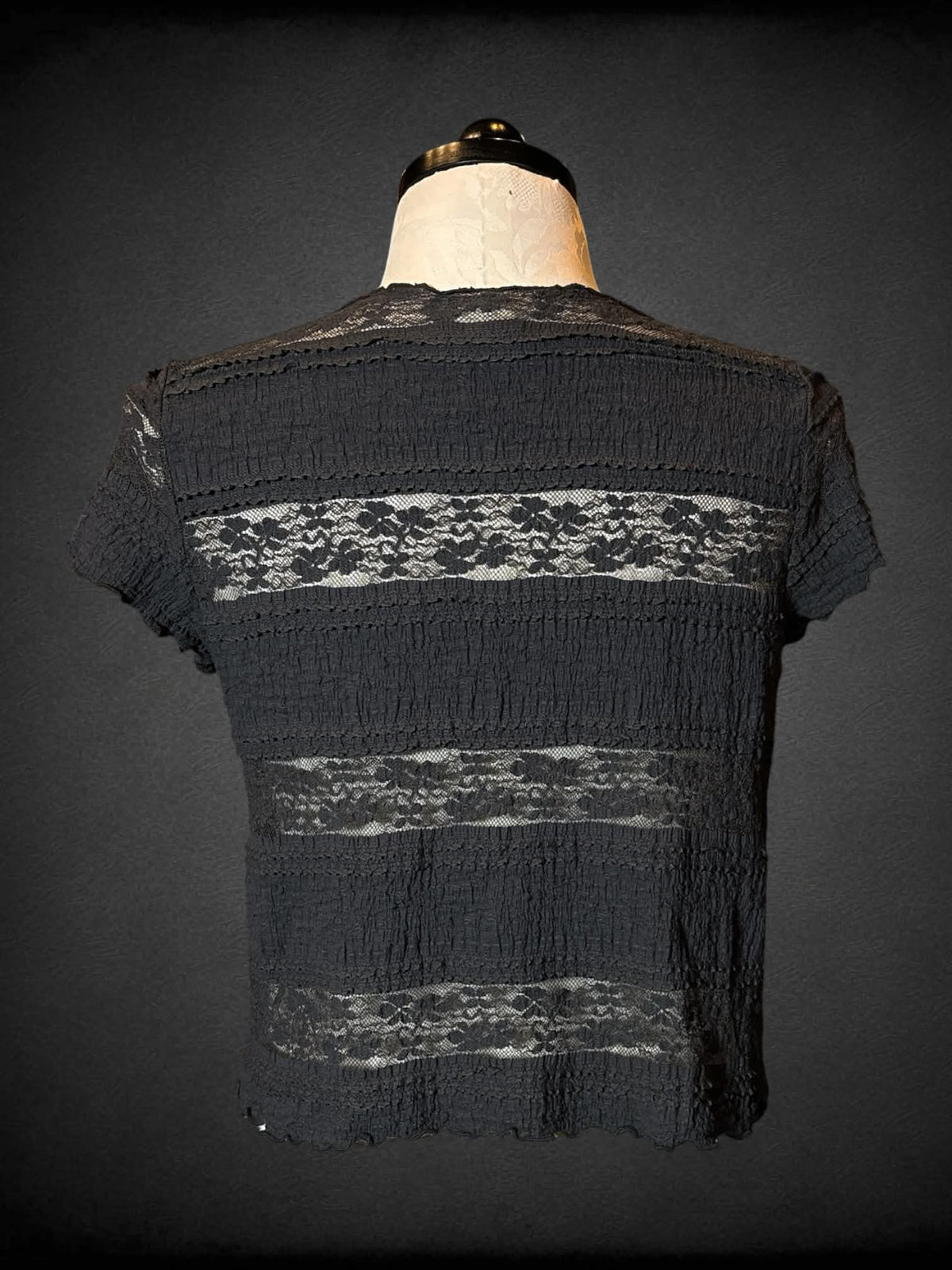 1X Festi black short sleeve top with paneled design, lace, and waffle knit portions