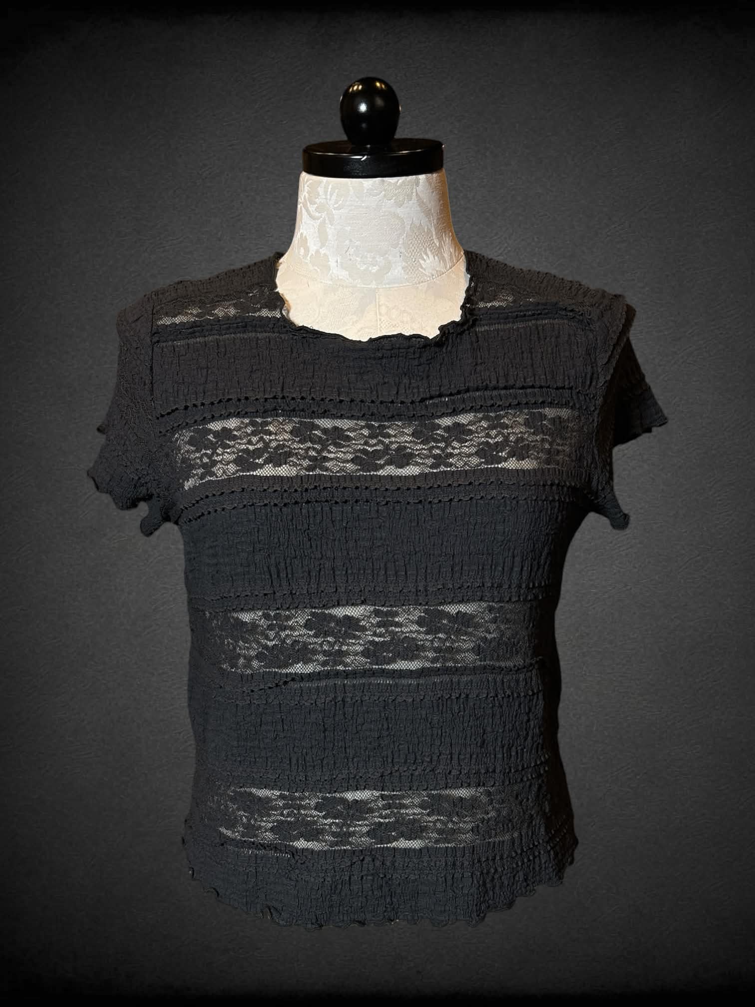 1X Festi black short sleeve top with paneled design, lace, and waffle knit portions