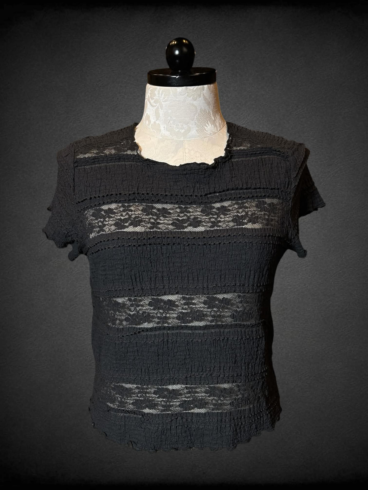 1X Festi black short sleeve top with paneled design, lace, and waffle knit portions