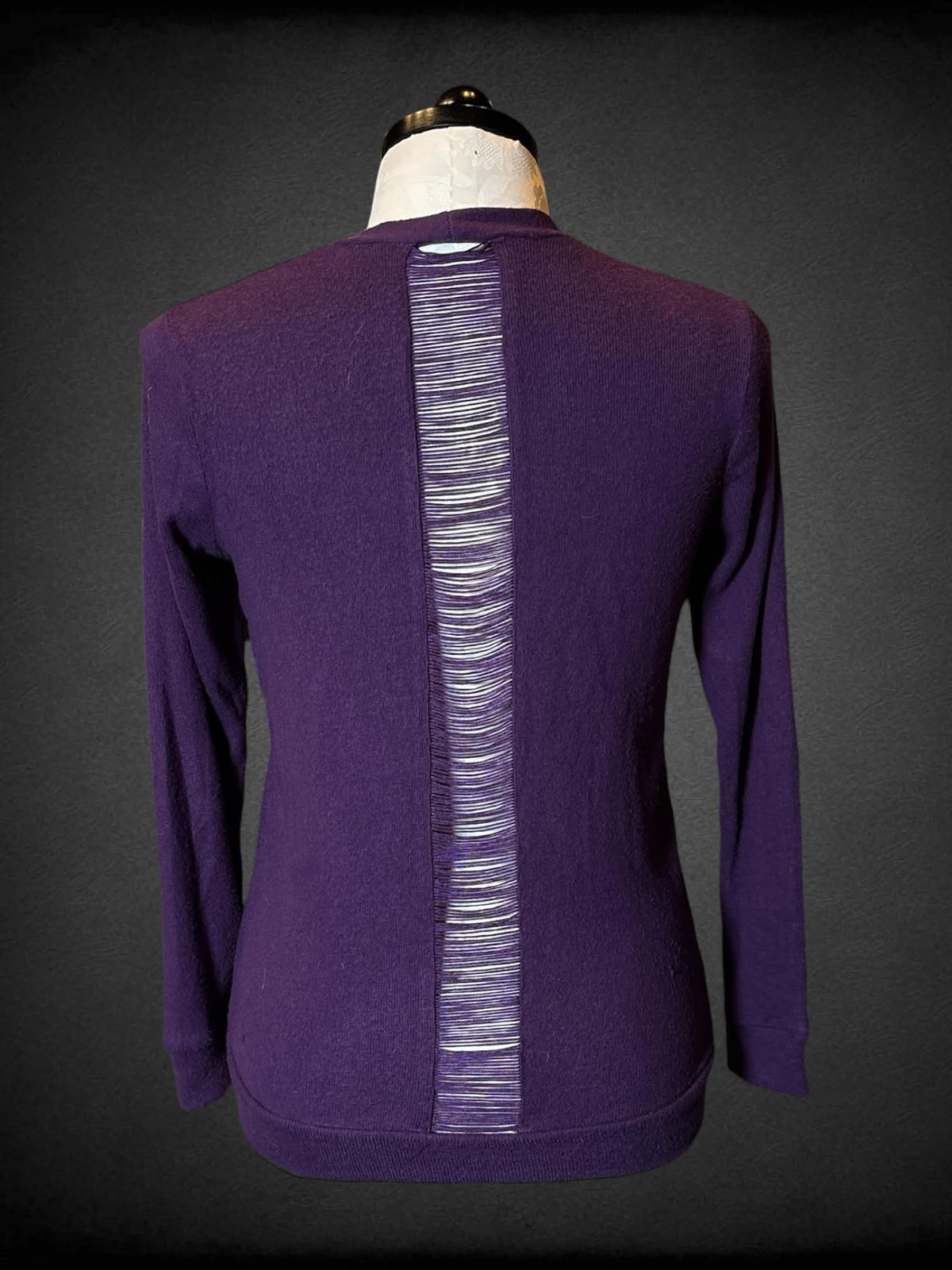 1X Midnight Hour purple long sleeved cardigan with peekaboo back, and skull buttons