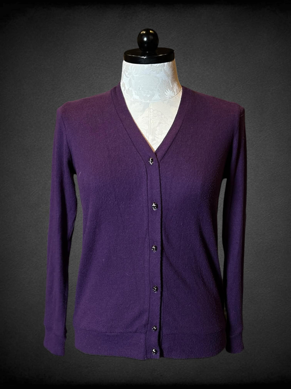 1X Midnight Hour purple long sleeved cardigan with peekaboo back, and skull buttons