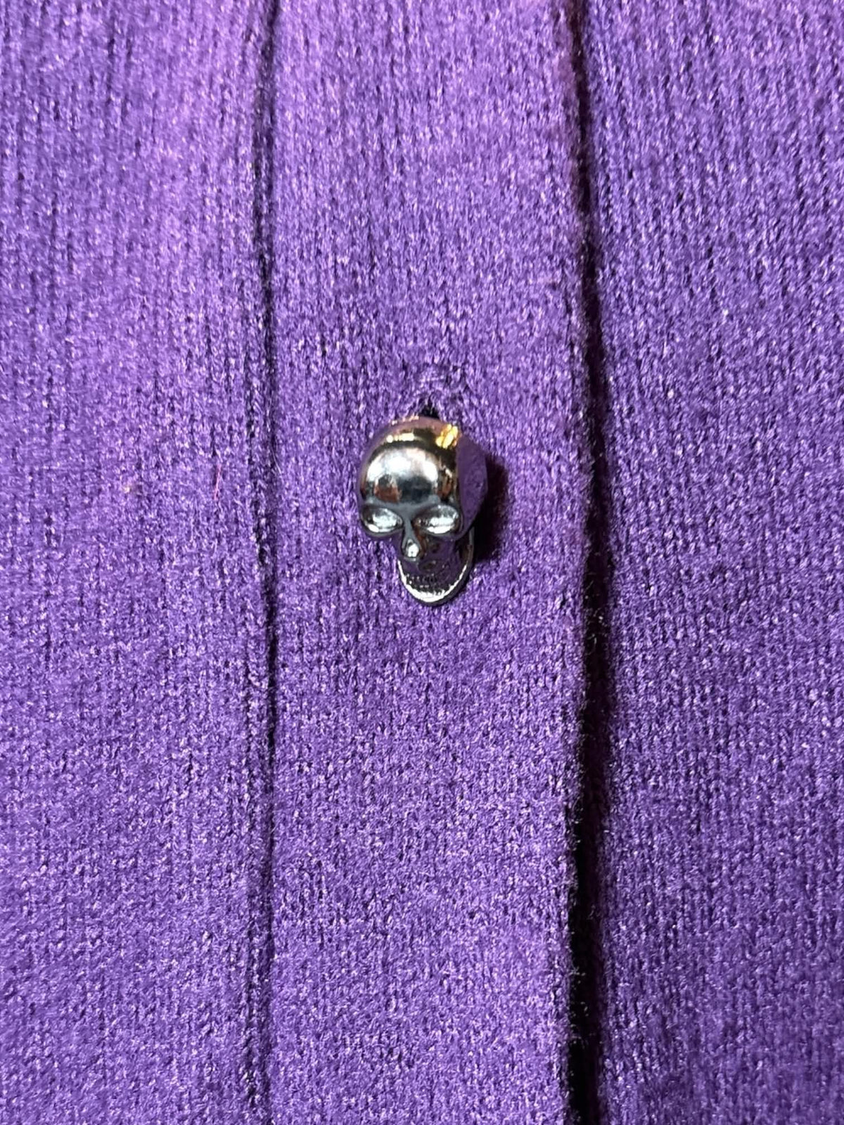 1X Midnight Hour purple long sleeved cardigan with peekaboo back, and skull buttons