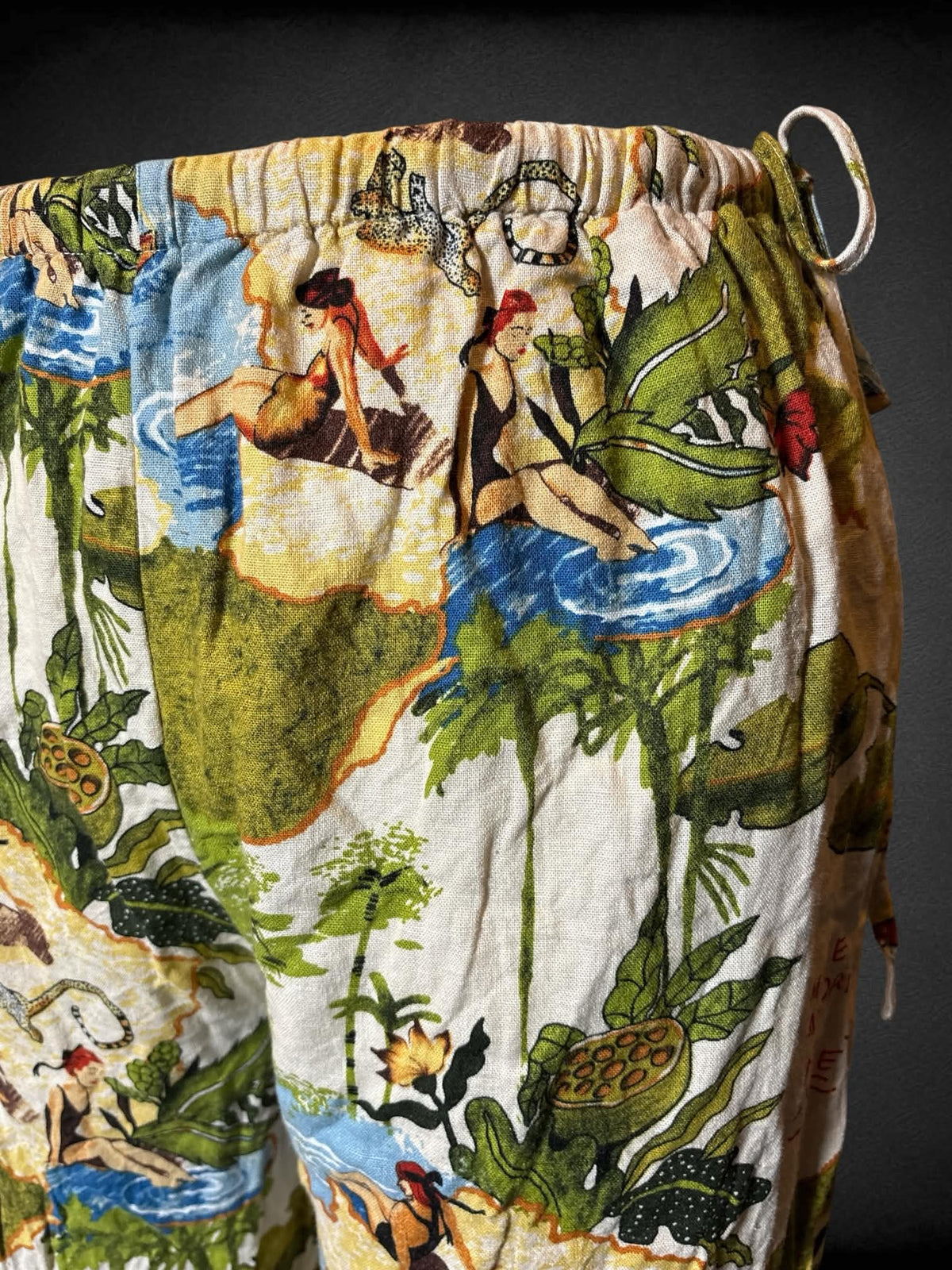 0X Rachel Zoe off white pants with tropical print, elastic waist, ties on sides, and pockets