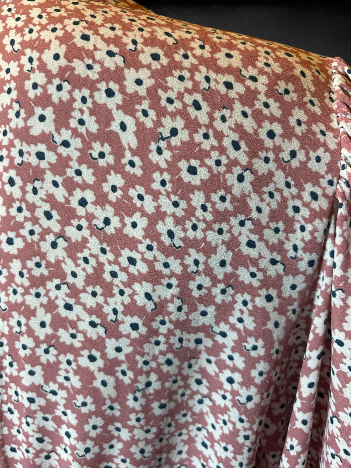 L Abercrombie & Fitch pink long sleeved faux wrap top with clasp in middle, floral design, shirred back, and balloon sleeves