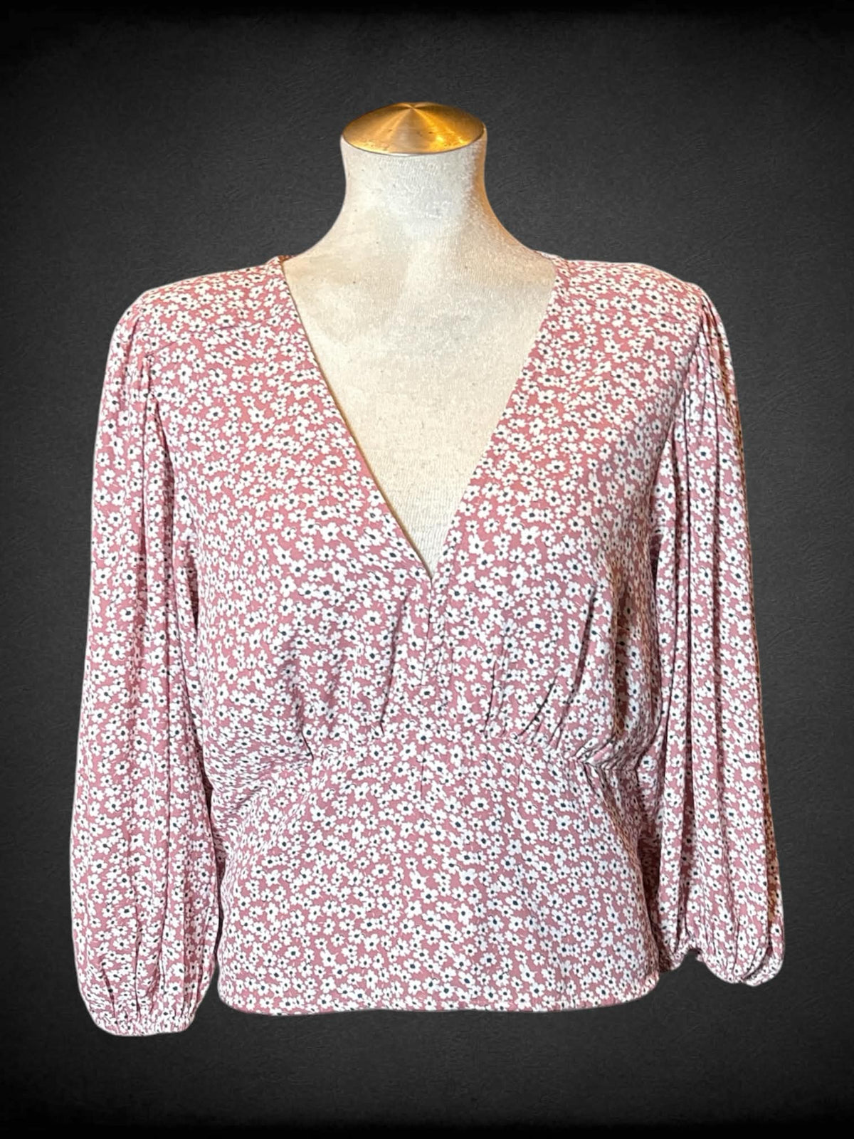 L Abercrombie & Fitch pink long sleeved faux wrap top with clasp in middle, floral design, shirred back, and balloon sleeves