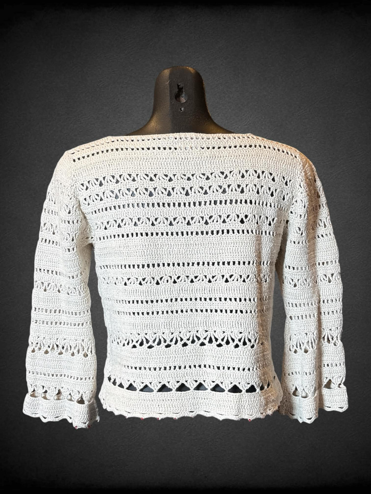 M Tommy Hilfiger hand knit off white knit top with tie on front, and red beads on bottom hem and sleeves