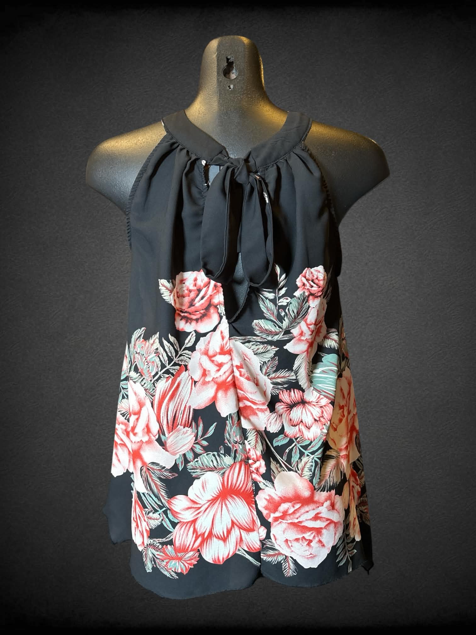 M Cleo black sleeveless floral top with tie on back, and pleated neckline