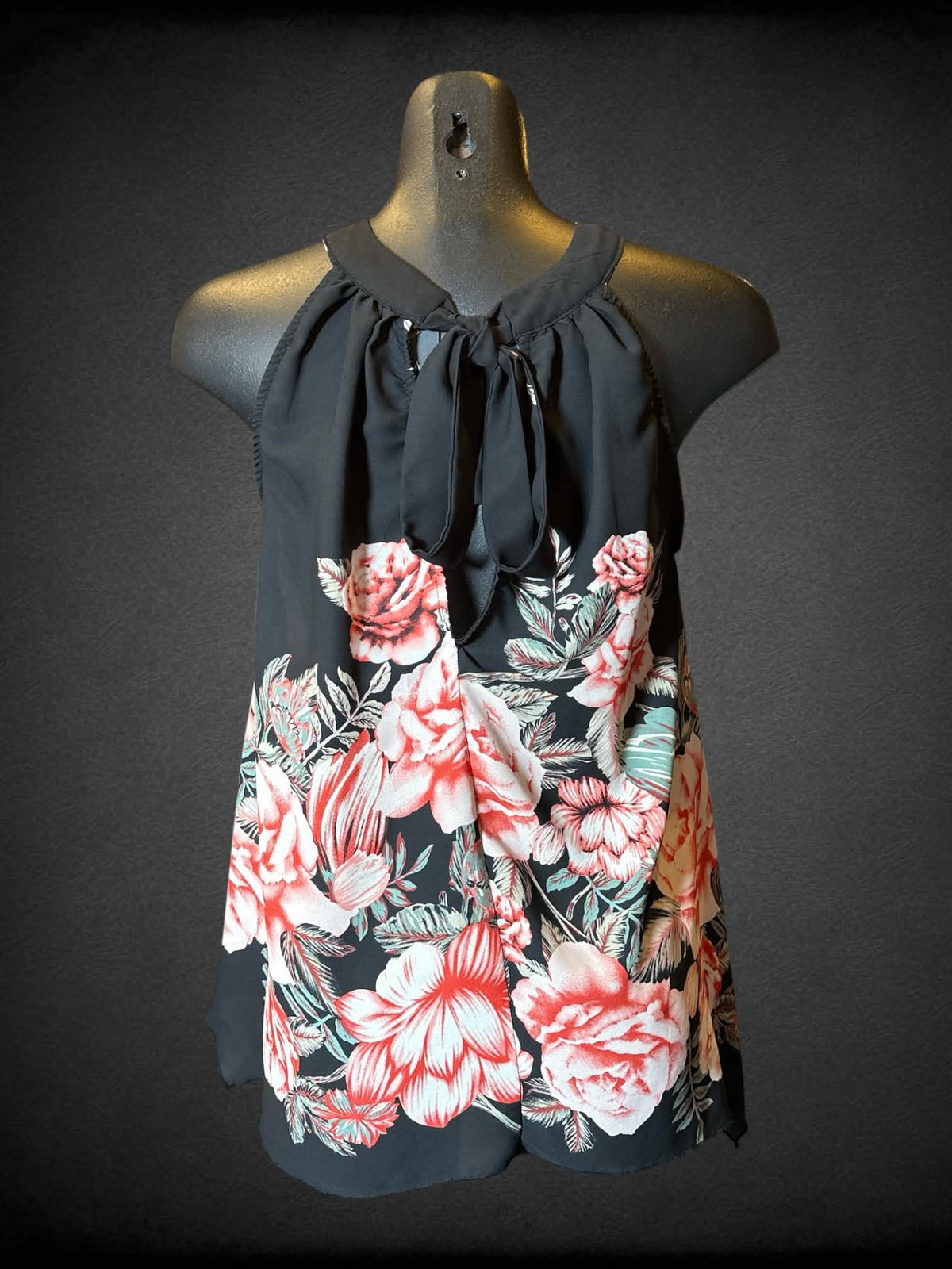 M Cleo black sleeveless floral top with tie on back, and pleated neckline