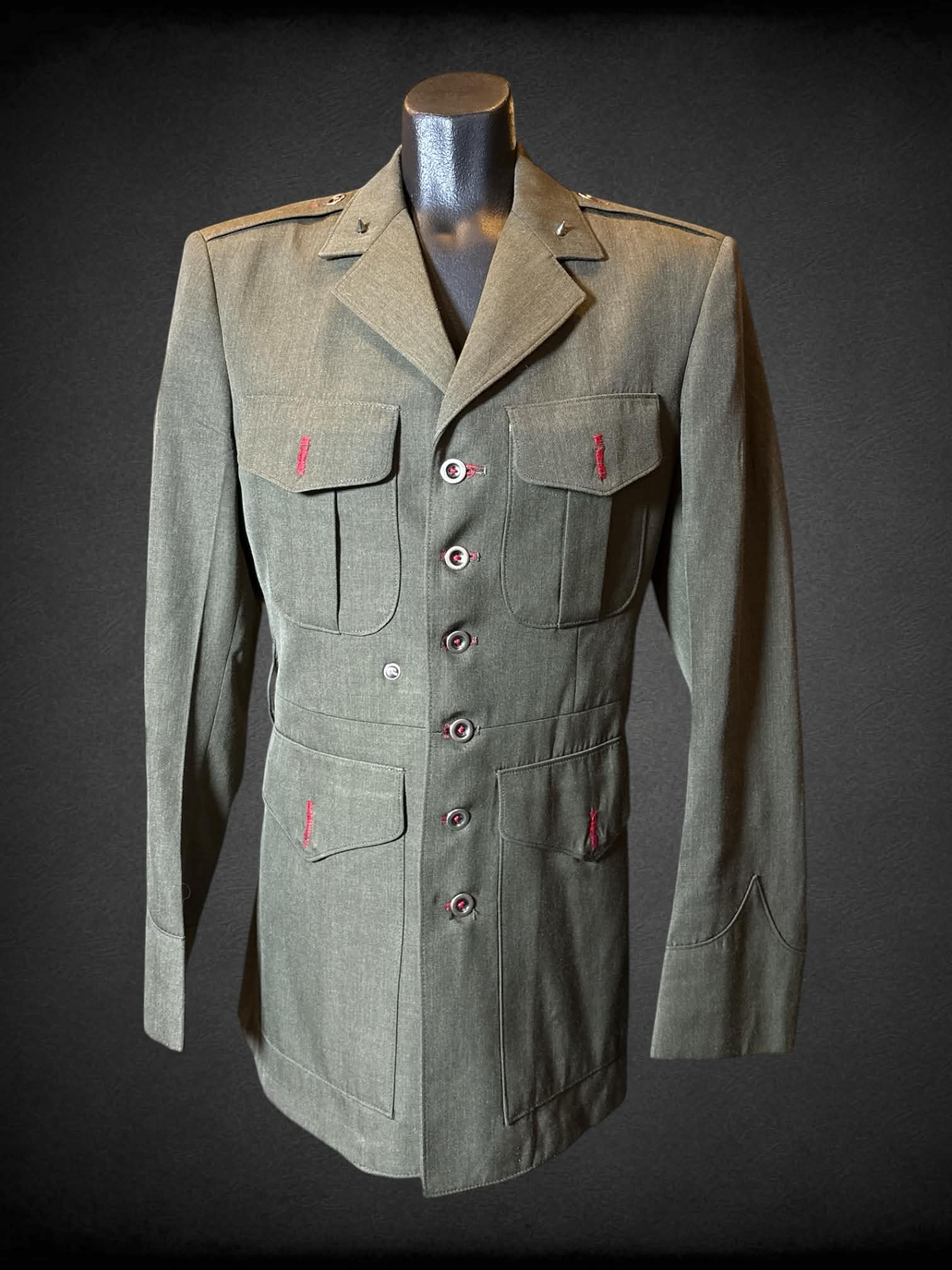M Crown Clothing Compant vintage modified military jacket with multiple pockets, studs on collar, and sewn shut button holes