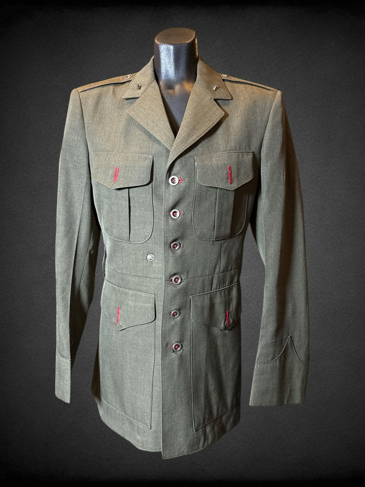 M Crown Clothing Compant vintage modified military jacket with multiple pockets, studs on collar, and sewn shut button holes