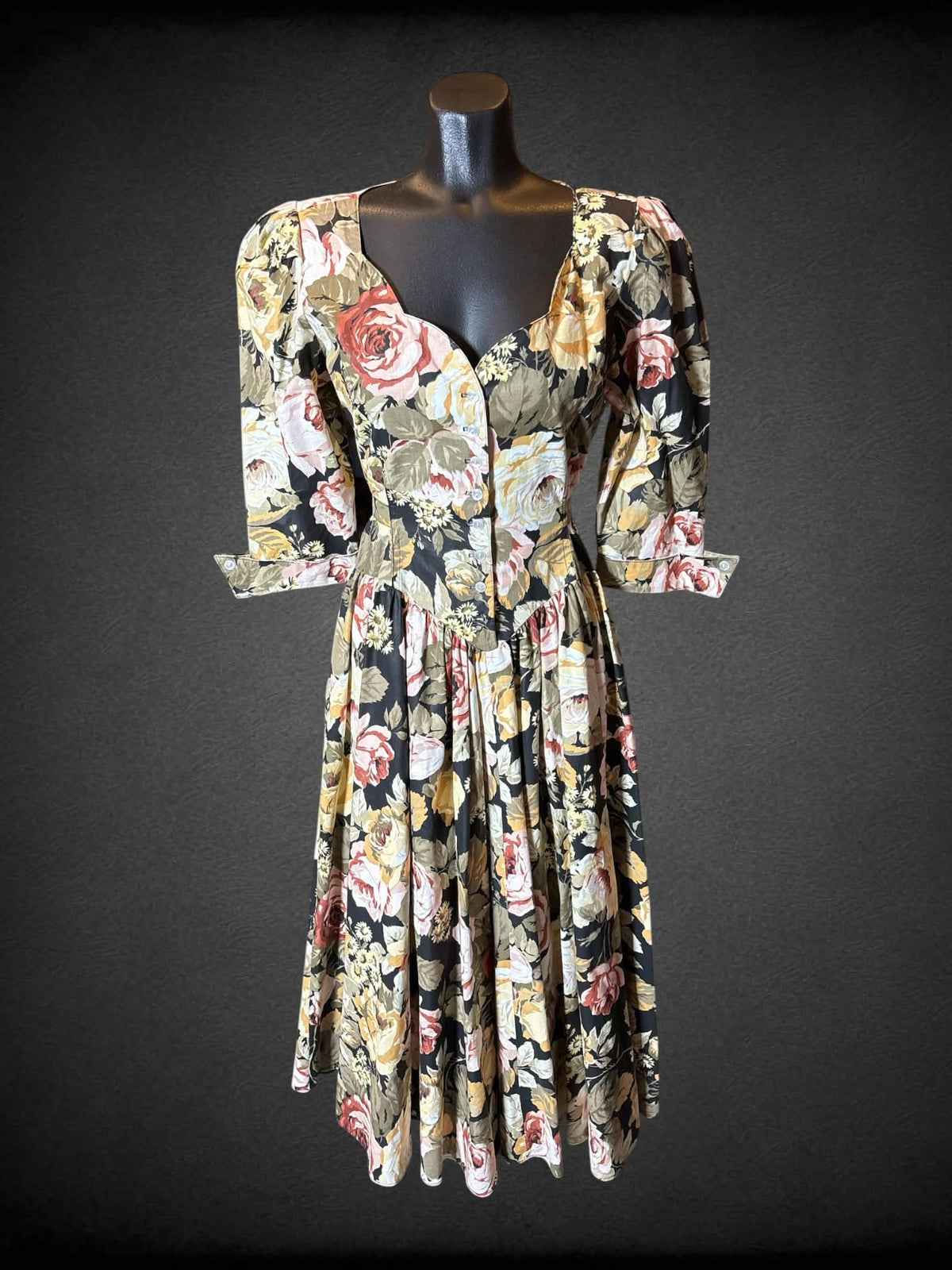 M Expo vintage black short sleeve floral dress with half buttons on front, tie on back, flared hips, and pockets