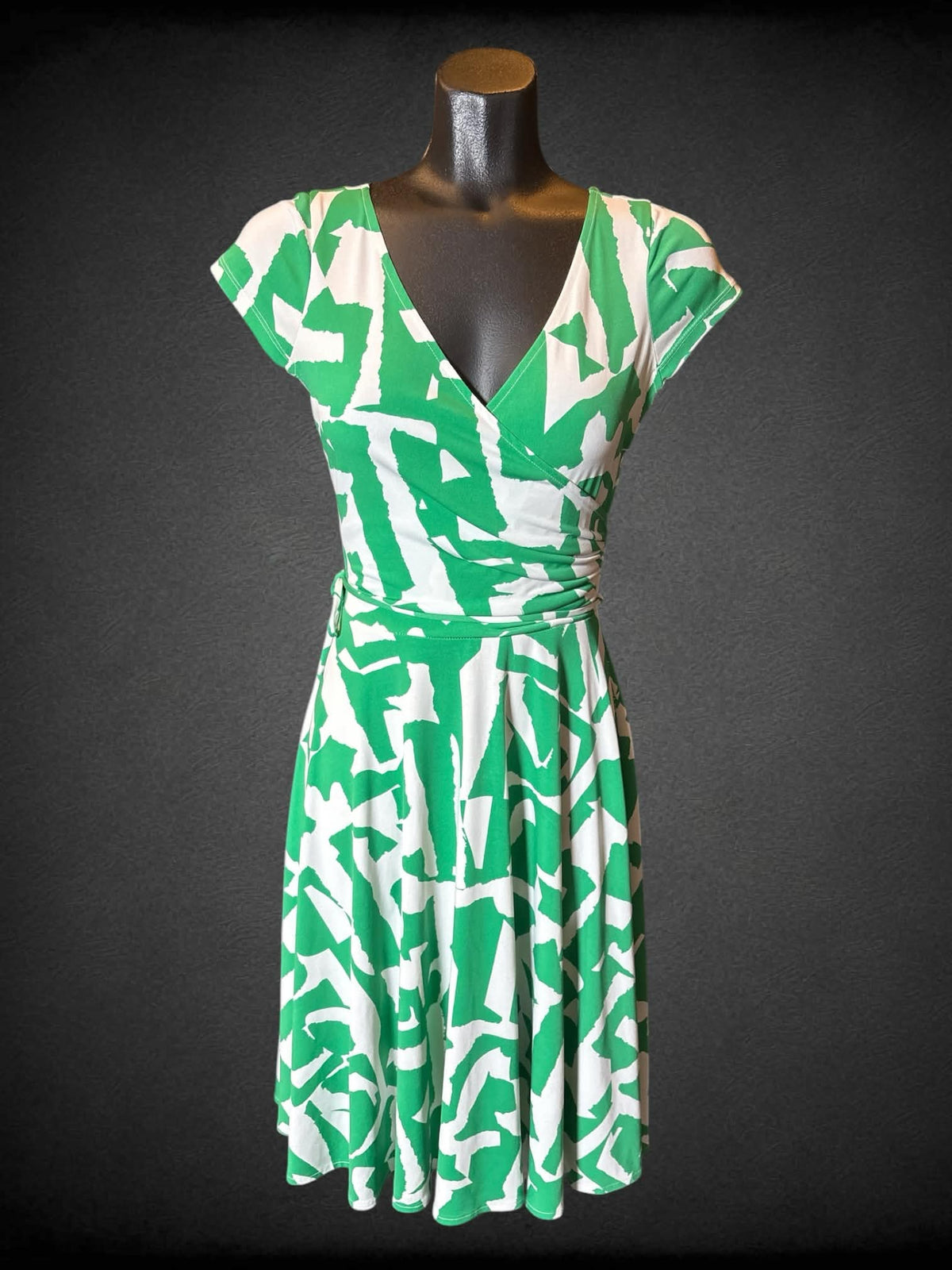 S Maggy London green and white short sleeve faux wrap dress with matching tie belt, one missing belt loop, and flowy bottom