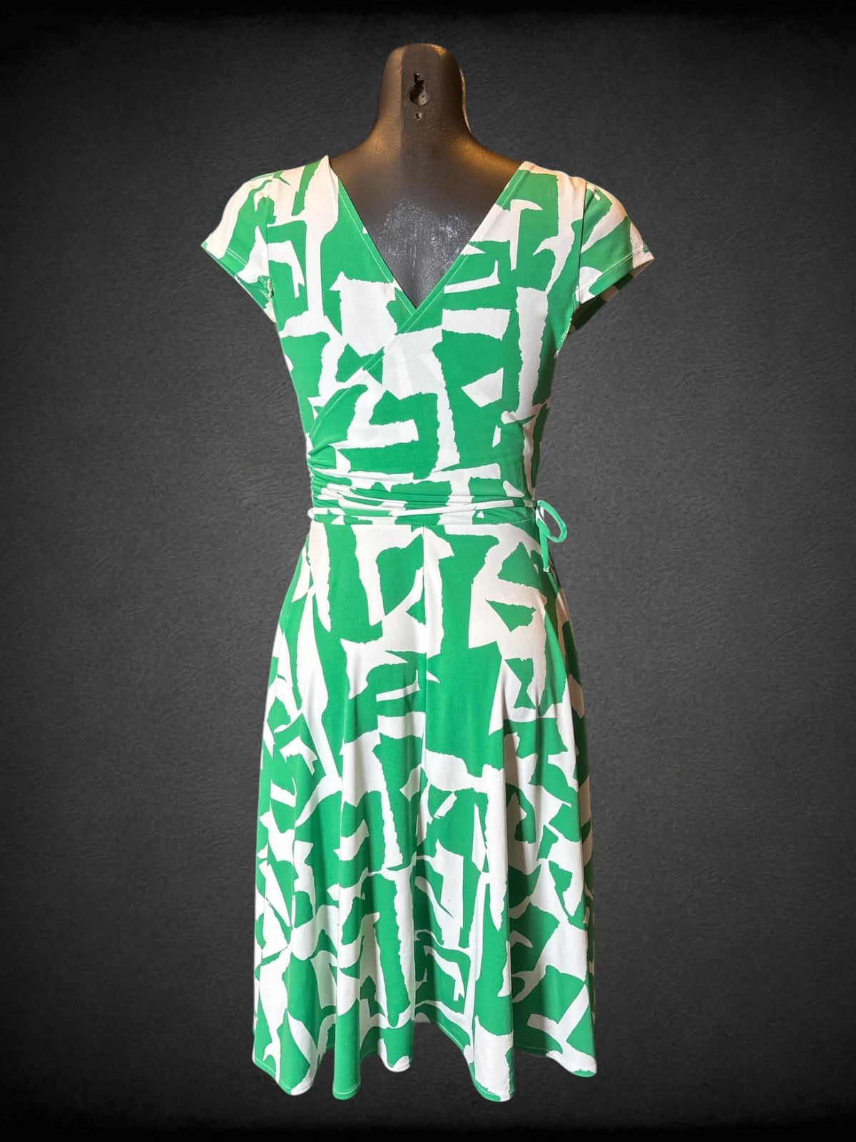 S Maggy London green and white short sleeve faux wrap dress with matching tie belt, one missing belt loop, and flowy bottom